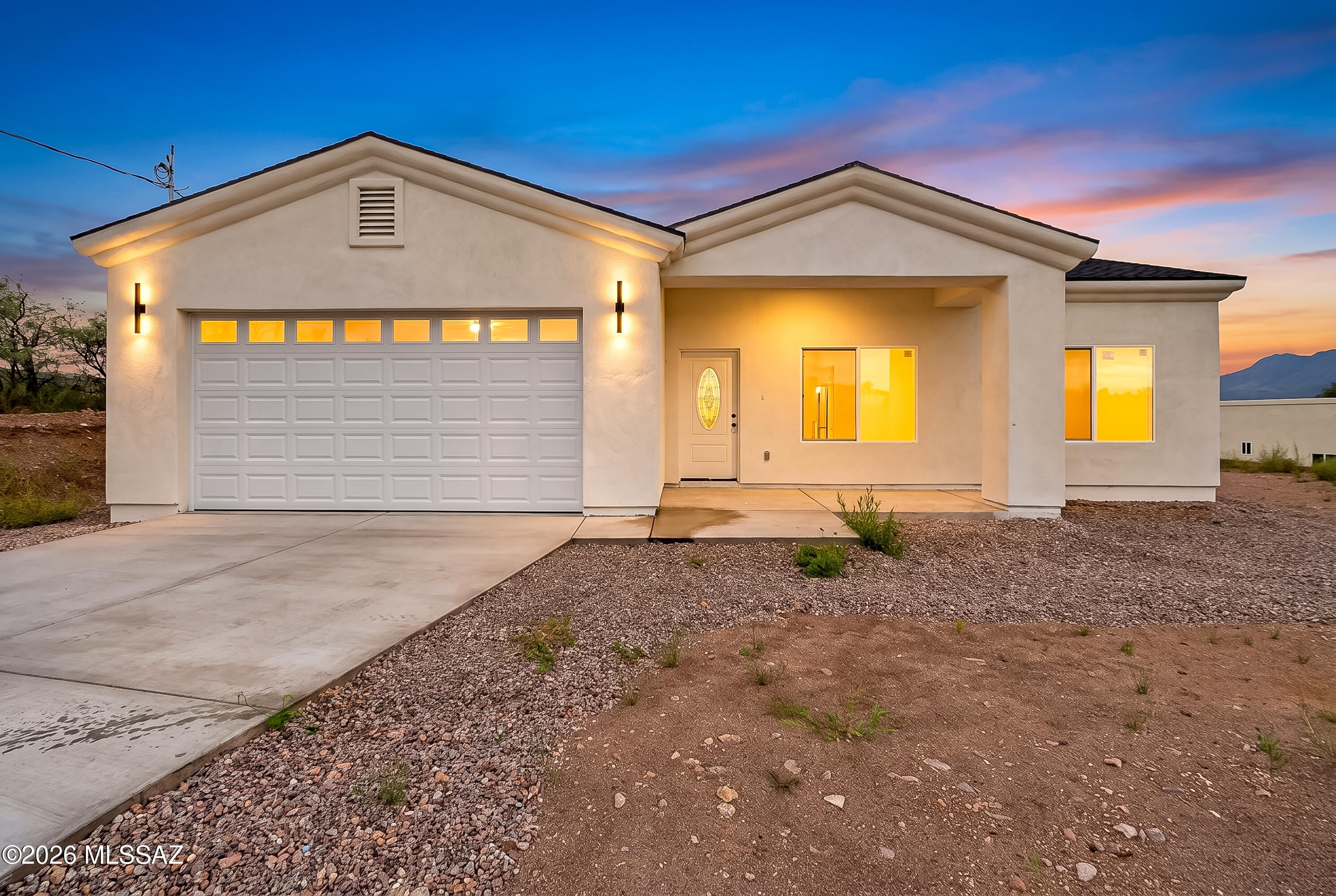 Welcome to this stunning new-construction home set on a desirable 0.74-acre lot. Offering 3 bedrooms and 2 bathrooms, this thoughtfully designed residence blends modern style with comfortable everyday living. The heart of the home features a bright, contemporary kitchen with crisp white cabinetry, beautiful granite countertops, and plenty of workspace for cooking and entertaining. Sleek tile flooring adds a polished touch throughout the main living areas, while the spacious bedrooms provide ample room for relaxation and personal style. Enjoy beautiful views and the privacy of a generous lot in a sought-after location. With its modern finishes, functional layout, and new-construction appeal, this home is an excellent opportunity to enjoy comfort, quality, and space in a desirable setting.