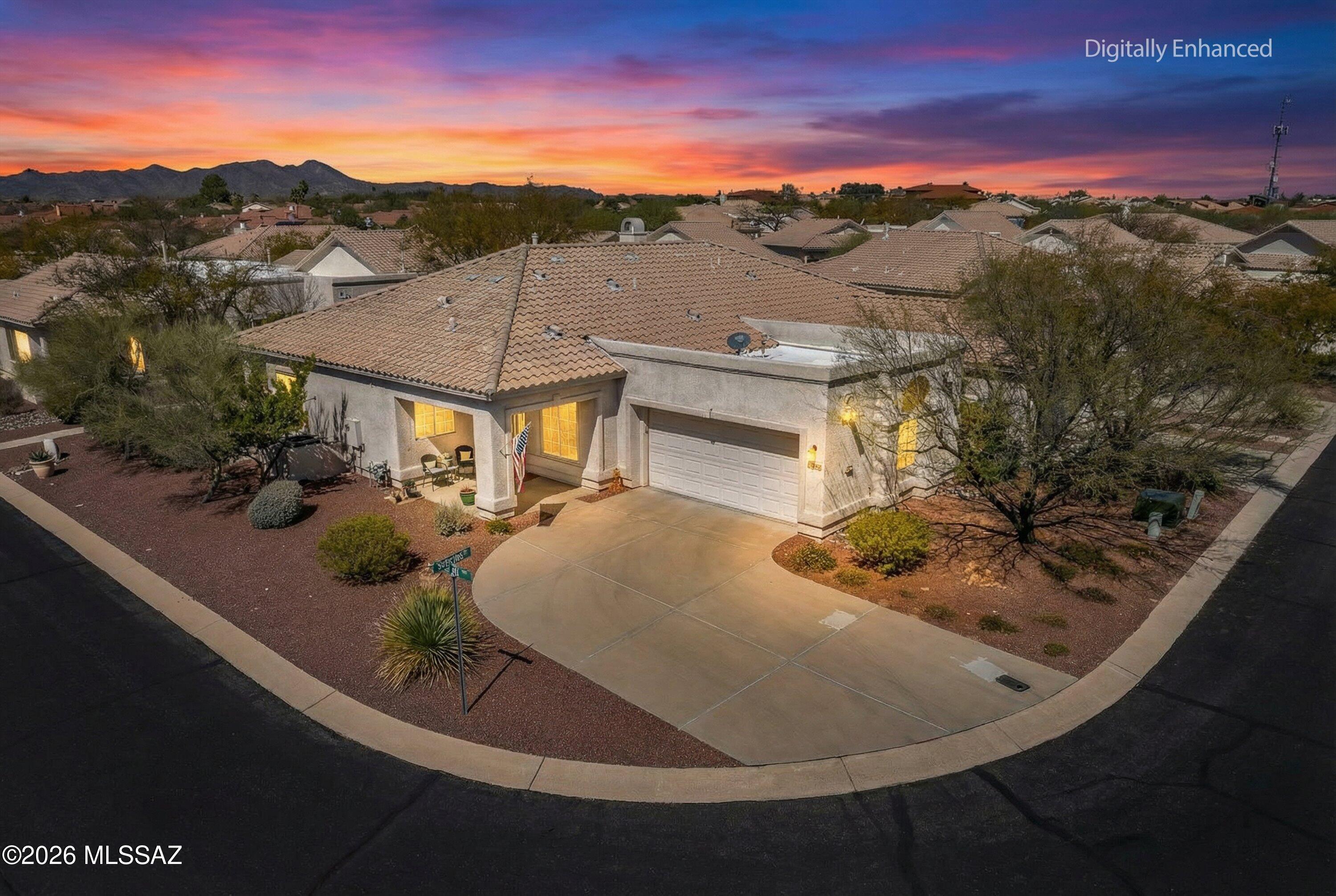 Enjoy carefree Oro Valley living in gated Carmel Pointe. Fully furnished and move in ready, this two-bedroom, two-bathroom townhome offers a NEW high efficiency air conditioner and furnace installed May 2025 with a 10-year warranty, plus a spacious 2 car garage. Soaring ceilings and natural light create an airy feel, while engineered hickory flooring adds warmth and style. Updated kitchen shines with quartz counters, newer cabinetry, pull out shelves, and stainless appliances. Spacious primary suite with new carpet, walk-in closet, and private bath. Relax on the oversized patio, your peaceful outdoor retreat. (Back patio wall can be raised to 48'') Low maintenance lock-and-leave living near golf, recreation, trails and dining. A Rare find like this will not last. Schedule a showing today!