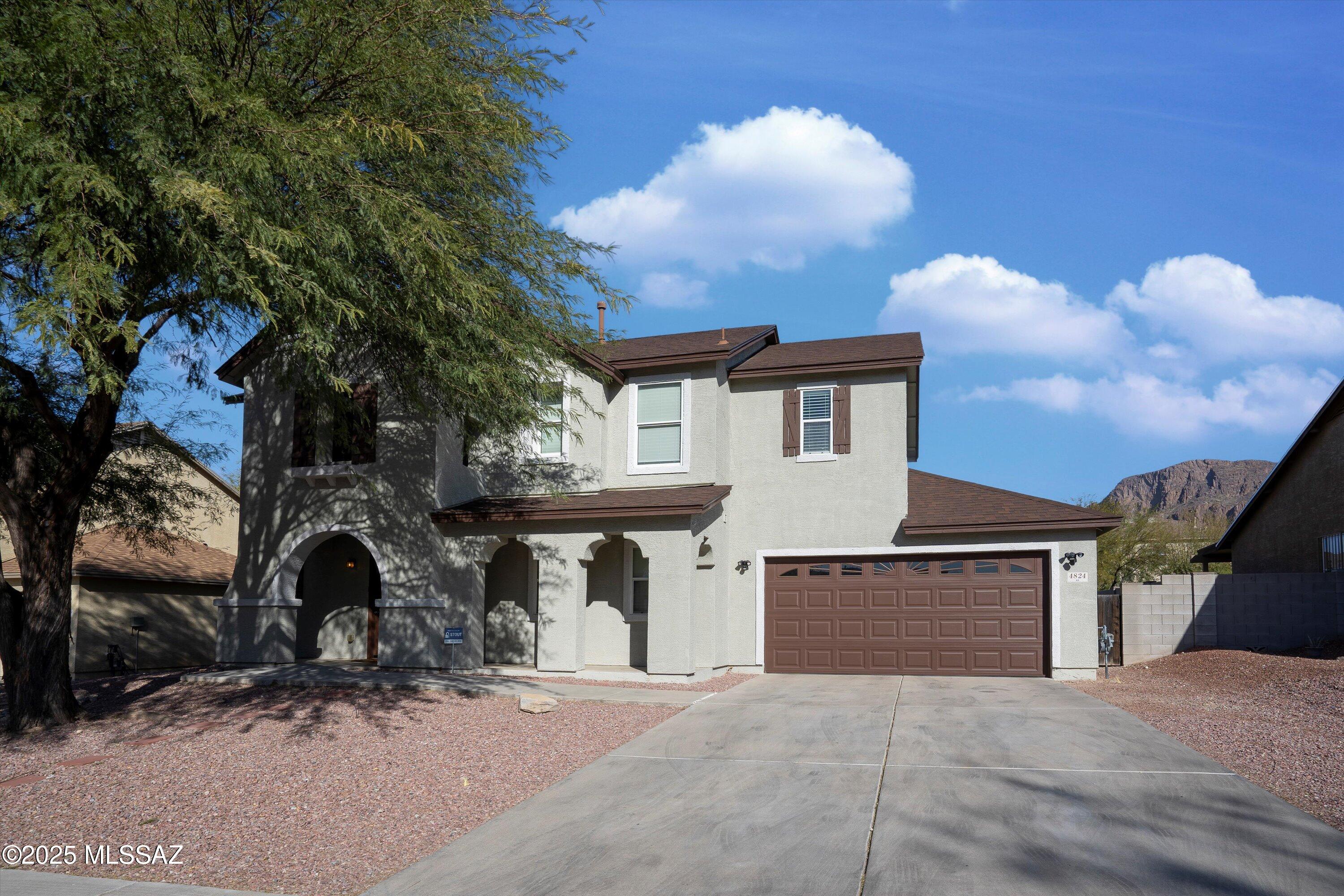 Entire home has been meticulously Remodeled and Fully updated! Featuring a modern kitchen is a chef's delight, equipped with sleek countertops, ample cabinetry, and state-of-the-art appliances.   Large spacious craft room with cabinets in laundry room, this home offers 3 generously sized bedrooms with ample closet space. The open concept layout connects the living, dining, and kitchen areas seamlessly perfect for everyday living and entertaining. Loft upstairs where you can enjoy family & friends. 2.5 Bathrooms remodeled with granite vanities and custom tiled showers.  Step outside to an expansive covered patio and a beautifully landscaped, low maintenance backyard, ideal for enjoying Tucson's outdoor lifestyle. From the backyard and upper level, take in breathtaking mountain views.