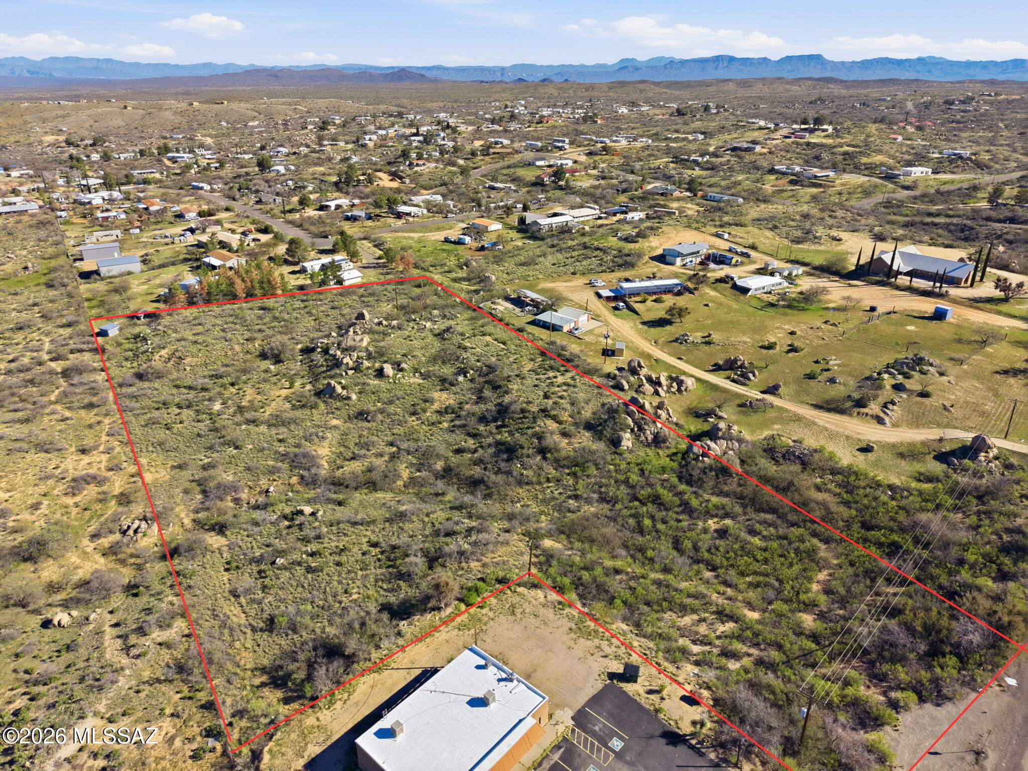 Discover 4.65 acres of panoramic mountain views in the quiet and scenic Oracle Ranch Estates area. This spacious parcel offers a rare opportunity to build your custom home with room to spread out while staying close to the charm of Oracle. Electric, water, and phone are available at the lot line, and the property sits just off a paved and county maintained road for easy access. The land features east and west exposure, stunning natural surroundings, and direct proximity to State land.  Septic is required. Conveniently located on the north side of Hwy 77, just east of American Avenue and near local amenities. A beautiful setting for anyone seeking privacy, views, and open space in a growing community.