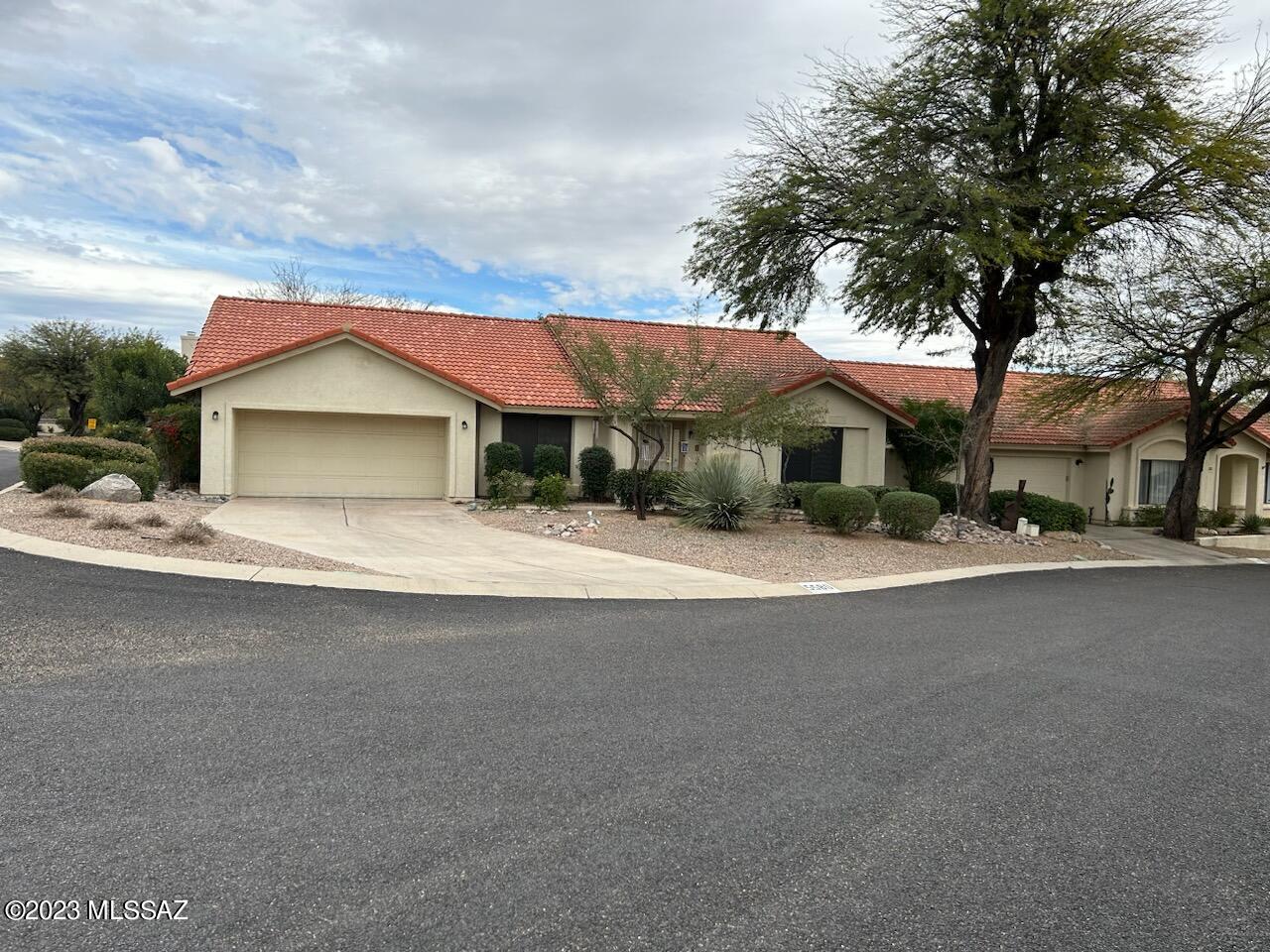 Open & bright is this exceptional 3 or 4 bedroom, 2 bath home close to Sabino and Ventana Canyon.  This home features newer appliances including washer/dryer.  Warm fireplace, tile. Rear yard has covered patio, low maintenance with a high wall.  Community pool just steps away.  Great location close to shopping & restaurants.  All electric home.