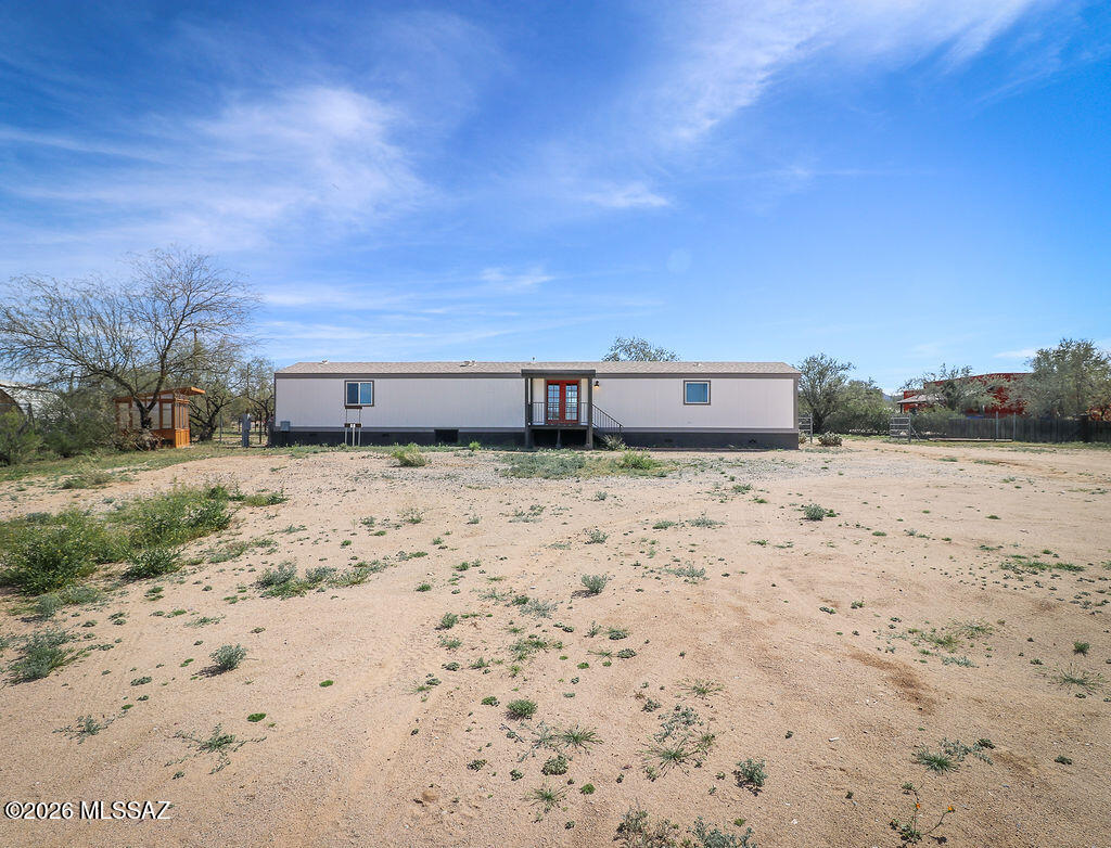 Must see! This beautifully maintained 3 bed/2 bath, 1995 manufactured home in Marana is sure to move fast. Featuring a brand new water heater, new 4-ton HVAC unit, new refrigerator, dish washer and fully built wood front porch and back patio with views for miles, this home is what you have been looking for. The 1.14 acre property features a 3 car port, multiple RV hook ups with direct access to drain to septic, a work shop with a 220 volt plug-in both inside the shop and outside for all of your electrical needs. A new fully build green house allows you to grow anything you want with ease. There is plenty of room to add any other features to the property you could imagine. Come see this affordable gem now before it is gone!