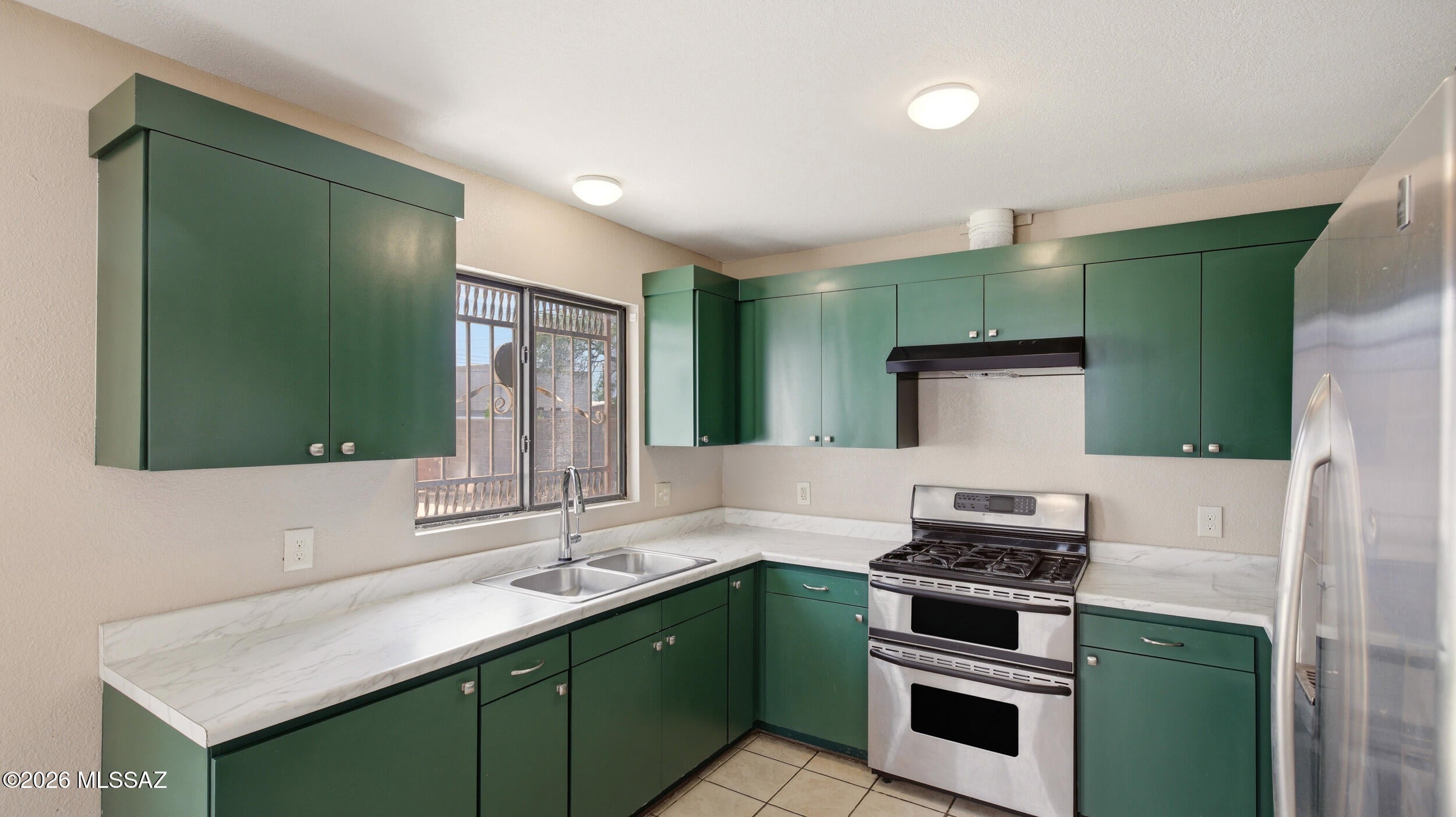 ***Range Price $349,000-359,000. Rare find with endless possibilities! This gated property offers a 1,307 SF main home plus a separate 700 SF guest house, creating an ideal setup for extended family, guests, rental income, or multigenerational living. The main home features 3 bedrooms and 2 bathrooms, while the private guest house offers 2 spacious bedrooms and a Jack-and-Jill bathroom. One room is already positioned for an easy kitchenette addition, with plumbing and electrical access in place. Live in the main home and rent the guest house for additional income, create a comfortable setup for family, or explore its potential as an investment property. Outside, enjoy an oversized driveway extending all the way to the backyard, a 2-car garage, and a spacious grassy yard between the homes--perfect for pets, entertaining or relaxing. The entire lot is gated for added privacy and security. A truly unique property offering flexibility, income potential, and space that's exceptionally hard to find. or relaxing. The entire lot is gated for added privacy and security. A truly unique property offering flexibility, income potential, and space that's exceptionally hard to find.