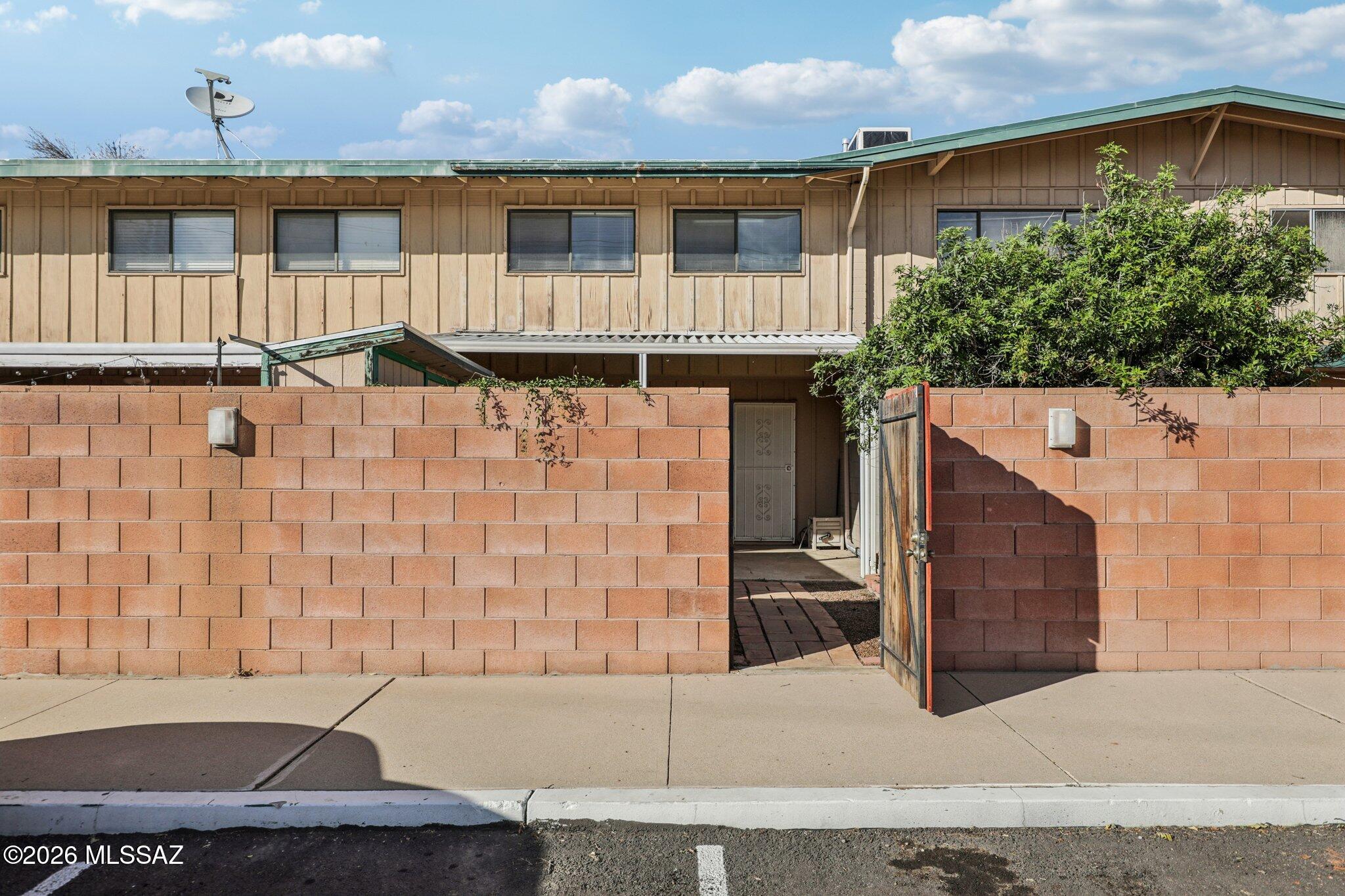 Welcome to this beautifully maintained co-op townhouse in Tucson! This well-kept unit features an updated kitchen, energy-efficient double-pane windows, and a private covered patio that is incredibly convenient to parking. Step outside to enjoy the community pool and the impeccably maintained grounds. Exciting things are happening in the community: under the guidance of a proactive new HOA management team, the property is currently undergoing a series of fantastic upgrades. This includes brand-new siding on all buildings, with this specific unit scheduled to be completed very soon! Enjoy true maintenance-free living, as your monthly fee covers heating and cooling, water, gas, exterior roof, and common areas.
- This is a Co-Op. Cash Purchase Only. Call with any questions you may have.