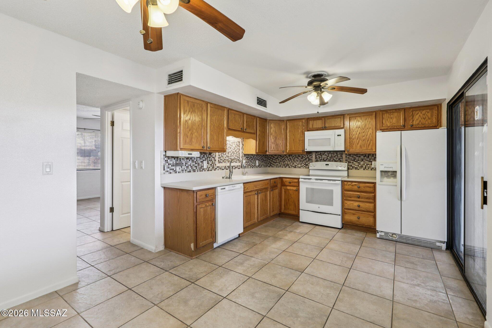 Welcome to this beautifully maintained co-op townhouse in Tucson! This well-kept unit features an updated kitchen, energy-efficient double-pane windows, and a private covered patio that is incredibly convenient to parking. Step outside to enjoy the community pool and the impeccably maintained grounds. Exciting things are happening in the community: under the guidance of a proactive new HOA management team, the property is currently undergoing a series of fantastic upgrades. This includes brand-new siding on all buildings, with this specific unit scheduled to be completed very soon! Enjoy true maintenance-free living, as your monthly fee covers heating and cooling, water, gas, exterior roof, and common areas.
- This is a Co-Op. Cash Purchase Only. Call with any questions you may hav