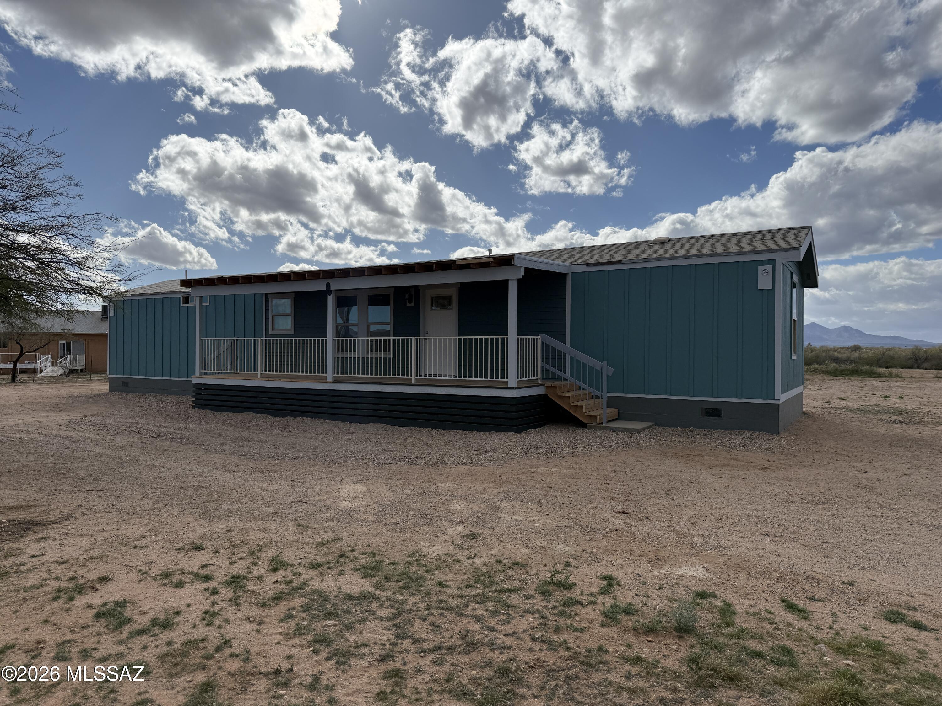 3 bedroom 2 bathroom Manufactured single wide home on 8.78 acres that only needs to be finished. No HOA! Paved road all the way to the house. Great fixer upper opportunity.