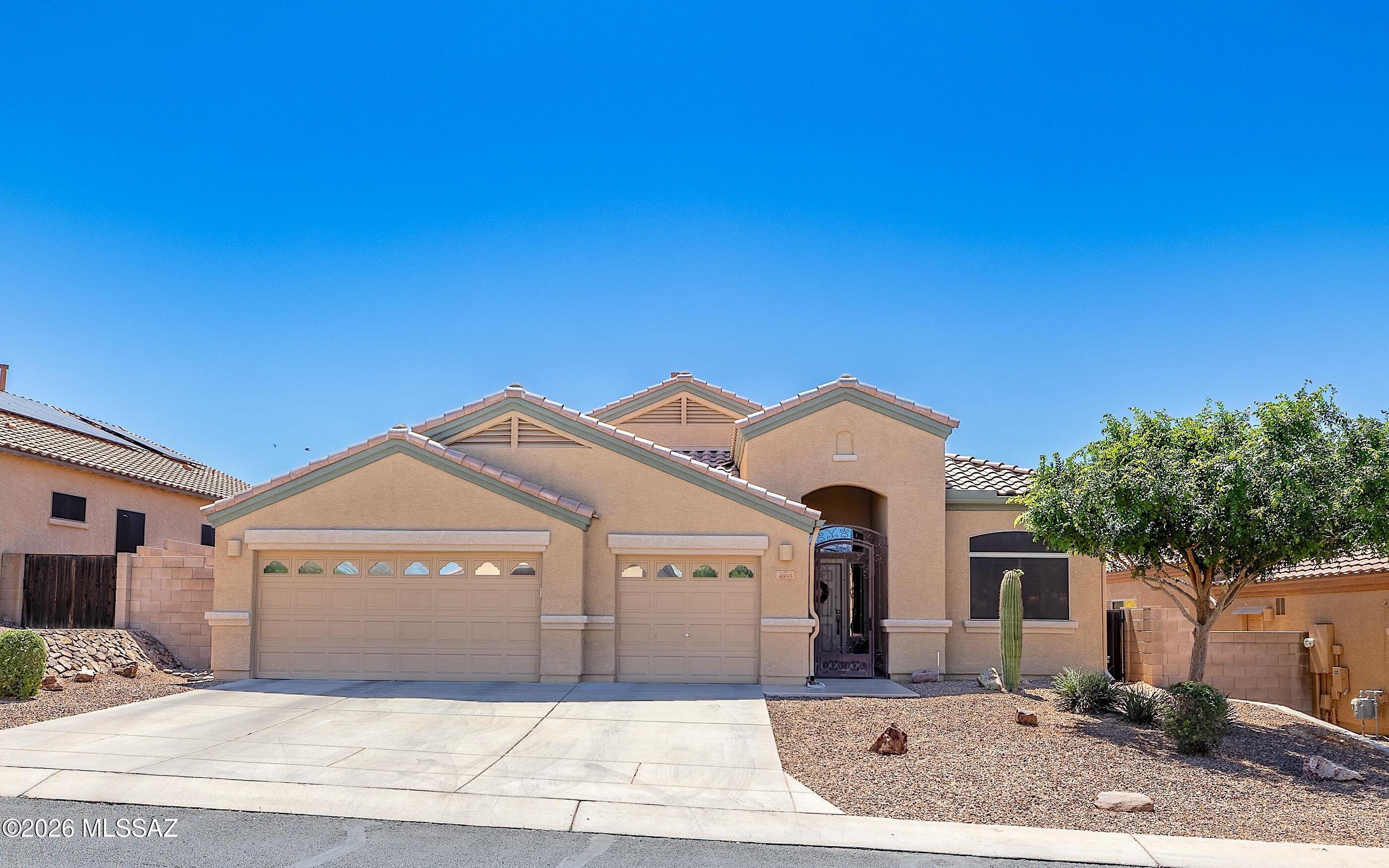 Improved Price! An impeccable Ranier model home in gated Preserve at Dove Mountain.  Immaculately clean, neat and pristine. Shows perfectly.  Full 3 car garage -3 bedrooms, open gourmet kitchen to relaxing and inviting family room. One of the most expansive/elongated rear patio decks in the subdivision w/built in BBQ station. Very spacious ''pool sized'' yard. Nicely graveled w/easy care landscape. Backing to natural desert landscape you will feel tranquility and nature just invites itself into your outdoor life. Lovely plantation shutters inside along with beautiful tile flooring throughout most of home except bedrooms.  Spacious garage has built in cabinets and epoxy floor. Brand new HVAC system just replaced March 2026!  This home is in excellent condition, shows absolutely fabulously. Property Highlights:
Size: 2,086 Sq Ft | Spotless condition inside & out
Parking: Rare 3-Car Garage
Location: Secure, quiet gated community
The Lot: Premium lot backing directly to a private desert wash (no rear neighbors!)
Outdoor Living: Massive 40x10 covered patio with a custom, built-in granite BBQ island
This is a premier lot and layout that natural desert-loving buyers will fall in love with.