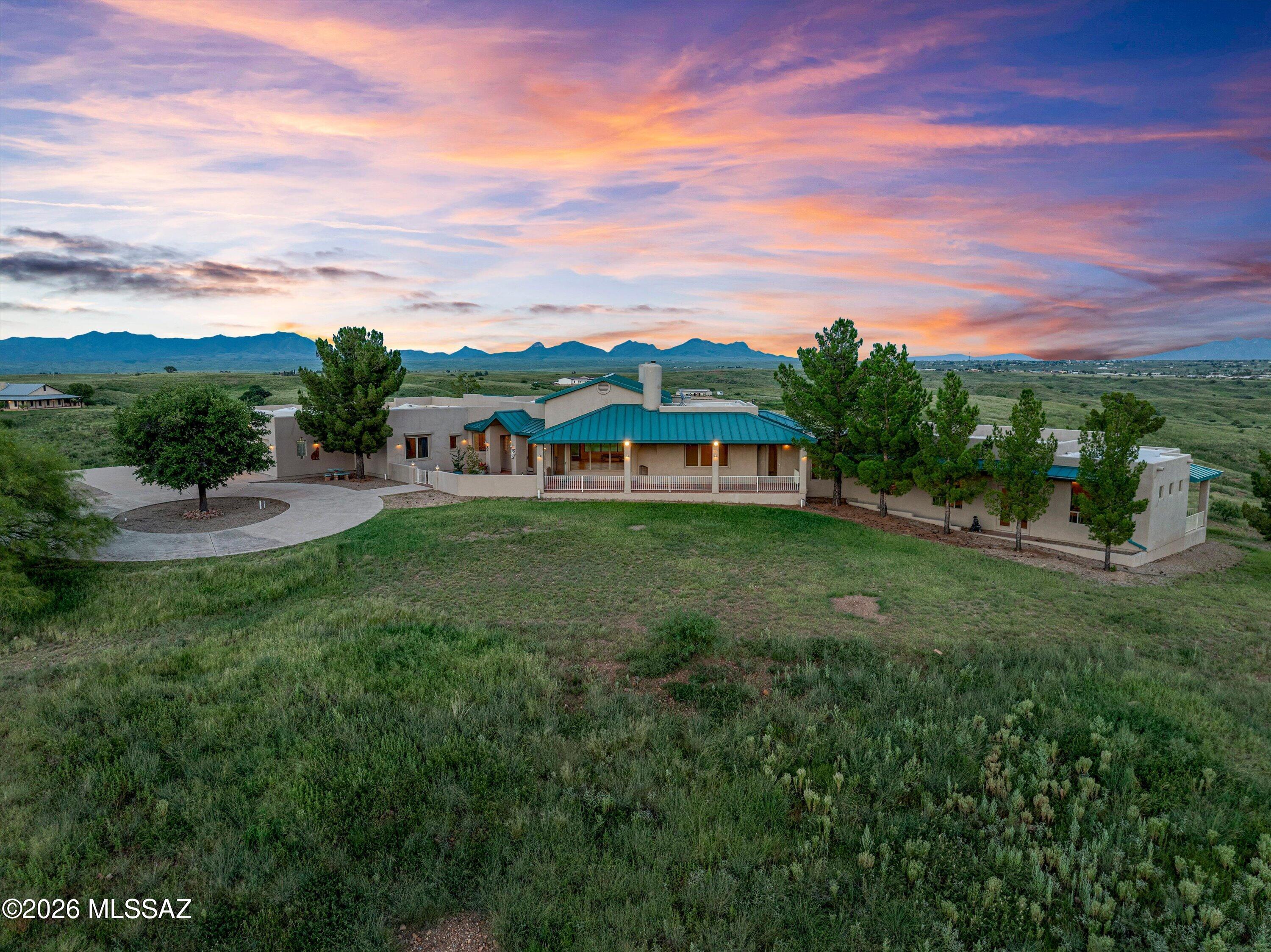 Discover a private retreat where refined living meets sweeping natural beauty. This custom residence rests on 36 pristine acres in exclusive Honnas Ranch, offering uninterrupted 360-degree views and true seclusion--yet remains conveniently close to town. Designed for elegance and outdoor passion, the property welcomes horses and RV living while delivering resort-style amenities indoors. An indoor pool and spa invite year-round relaxation, and a private guest house offers sophisticated space for family or guests. Young fruit trees in the garden bring something unique. This is a rare opportunity to own a private sanctuary of space, views, and refined comfort in one of Southern Arizona's most desirable areas. This property has all the amenities you need and room to expand and add more.