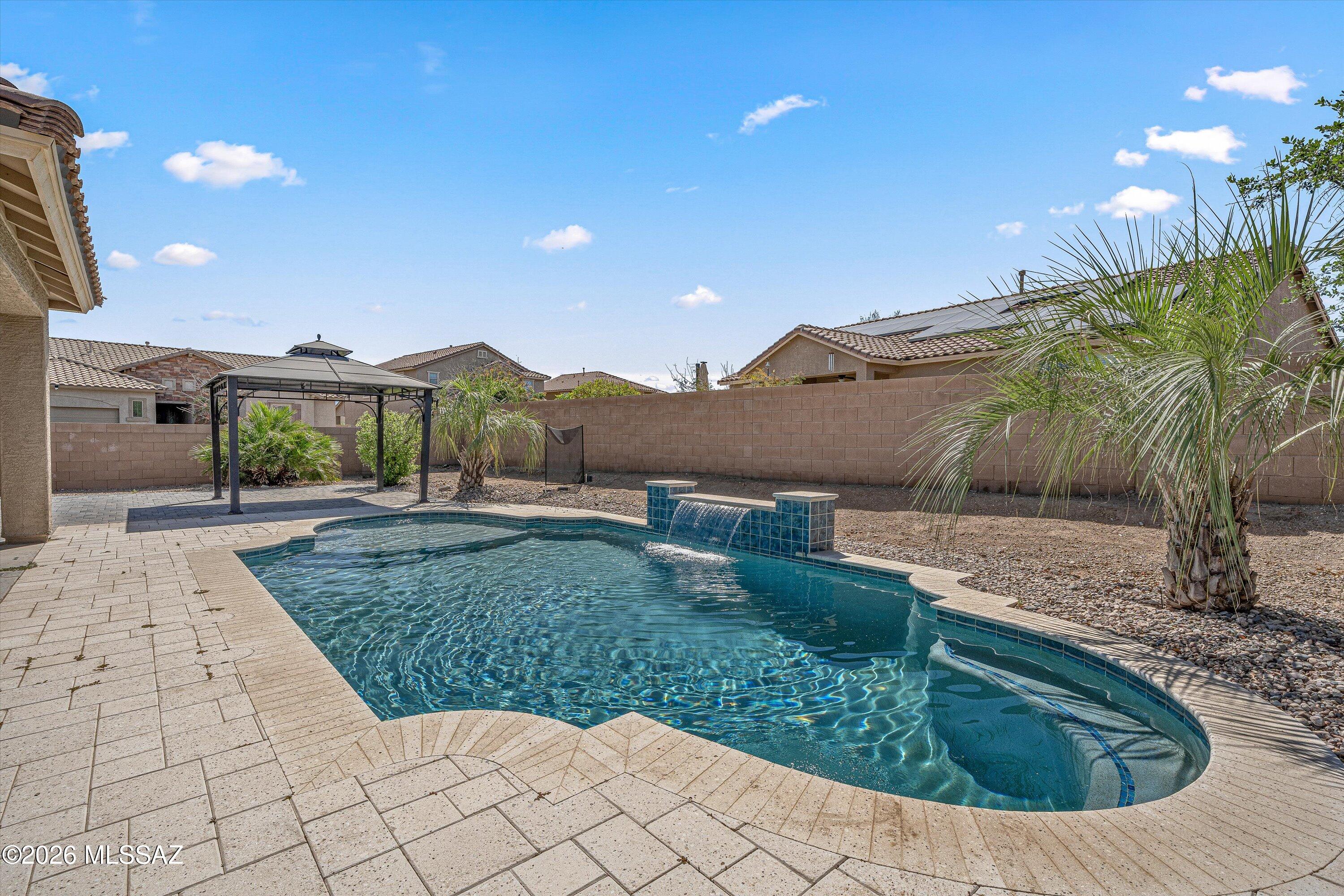 Welcome to this beautiful must-see home, a stunning five-bedroom, three-bathroom treasure tucked away on a lovely corner lot in Marana, AZ. As you step inside, you'll be greeted by a bright and open layout that makes the space feel inviting and full of life. The heart of the home features a cozy living area that flows smoothly into the dining space and kitchen, perfect for family gatherings and entertaining friends. One of the best features of this home is the private Next Gen Suite, which has its own entrance, making it an ideal space for guests, in-laws, or even as a fun game room for family activities. With its modern touches and thoughtful design, this home is truly a place where comfort meets style.
