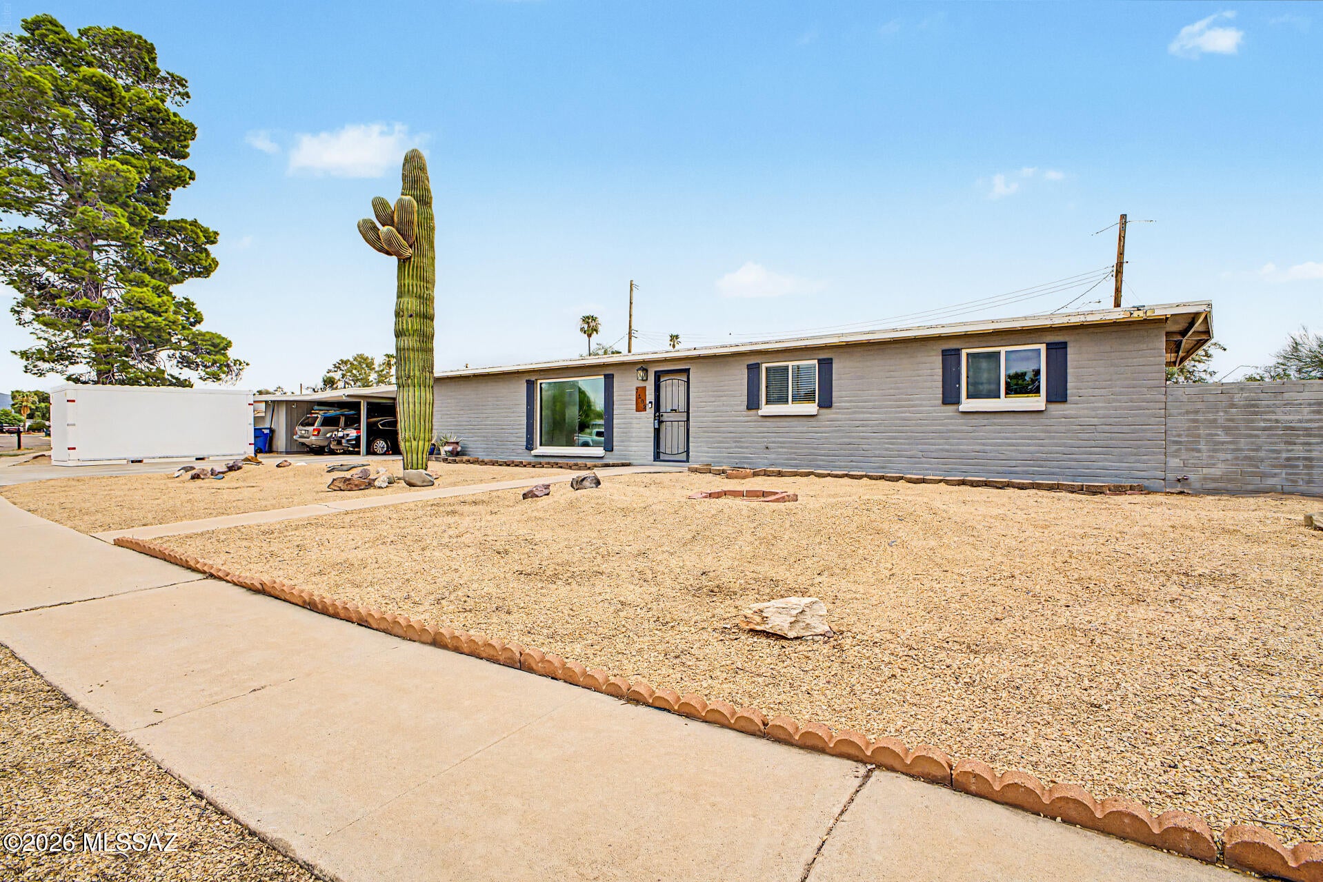 Discover all the charm of this lovely single-level home with easy-maintenance landscaping and convenient carport parking! Situated on a CORNER LOT with a great location close to restaurants and shopping!  Inside, you'll find inviting living areas designed with comfort in mind, featuring tile flooring, plenty of natural light, and a soothing palette throughout. Whip up your signature.  dishes in the great kitchen, complete with shaker cabinetry, tile backsplash, a granite peninsula, and essential appliances. Relax after a long day in the primary bedroom, which offers a full bathroom for added comfort. The expansive backyard provides ample space for storage, entertainment, and outdoor relaxation. this offer is range priced.  owner will accept offers between 290,000 to 305,000