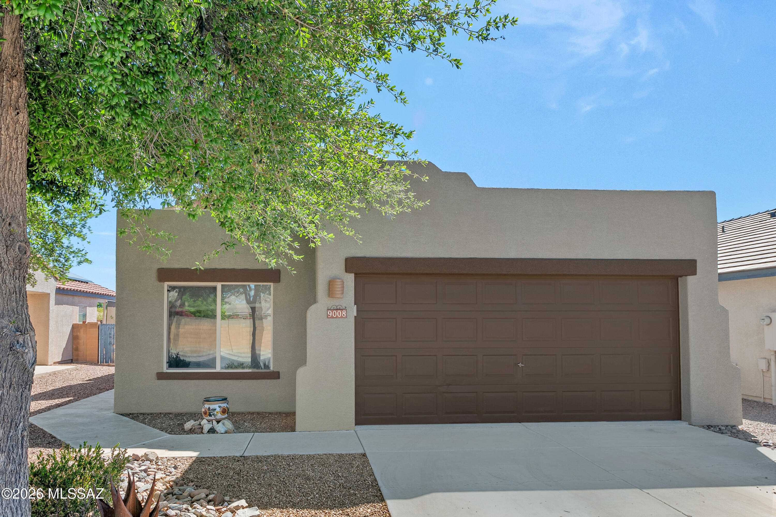 This little gem backs up to a natural wash with spectacular mountain views and offers a light and bright home! The open concept kitchen flows seamlessly into the spacious great room and features natural wood cabinetry, newer appliances, a cozy eating area,  all highlighted by a large window overlooking the beautifully landscaped backyard.Step inside to a generous great room with vaulted ceilings and a sliding glass door that leads to an extended patio perfect for enjoying Arizona's outdoor living and breathtaking mountain scenery. The popular split-bedroom floor plan offers privacy and comfort.The master suite boasts tile flooring, a large walk-in shower, double sink vanity, and a spacious walk-in closet. Additional updates include newer appliances and freshly cleaned carpets making this home truly move-in ready.
Don't miss out on this charming, well-maintained gem!