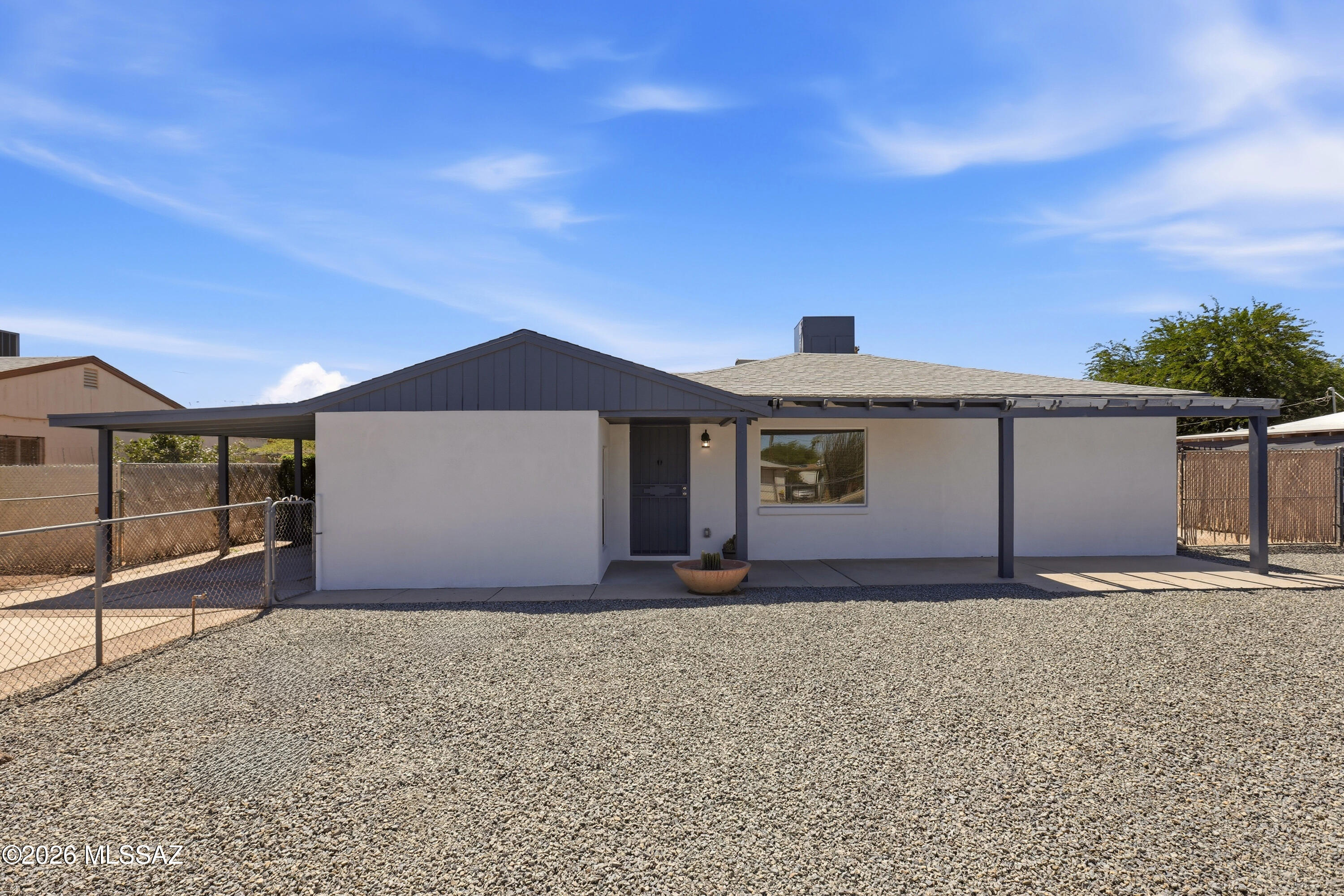 Completely remodeled 3BR/2BA home with 1,294 sq. ft. on a large lot in a central Tucson location, just minutes from the U of A. Features include a beautifully updated kitchen with soft-close cabinets, granite countertops, black subway tile backsplash, & new stove and dishwasher. Enjoy wood-look ceramic tile throughout, updated bathrooms with granite counters and tiled shower. Major system upgrades provide peace of mind including new plumbing, energy-efficient windows, HVAC, exterior stucco, & a recently updated roof. Detached 1-car garage with workshop, additional carport, RV parking, covered patio, low-maintenance yard, and no HOA! A perfect primary home or investment opportunity!