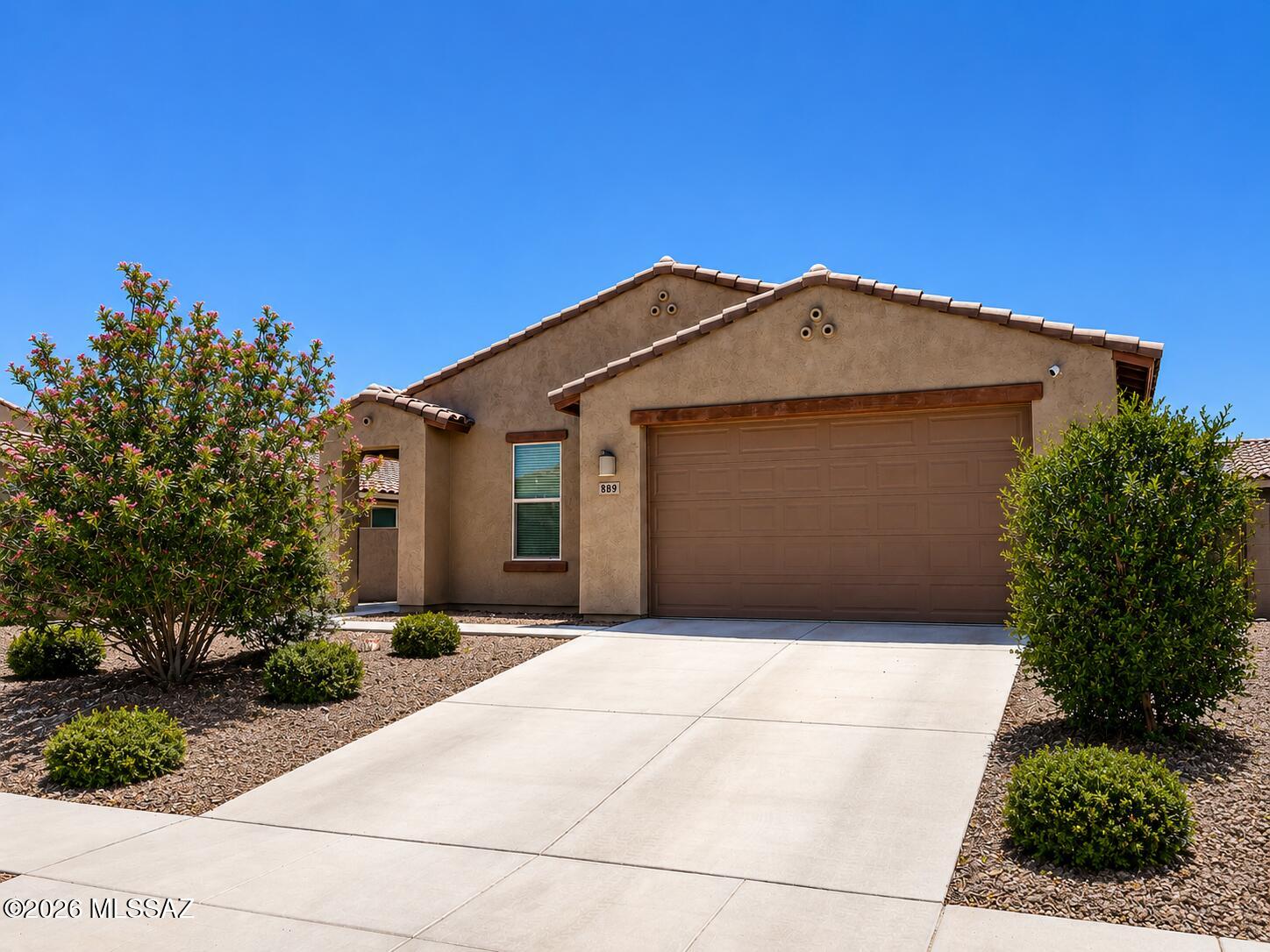 Welcome to this stunning, move-in-ready home built in late 2022. Spanning 1,960 sq. ft., this airy open-concept floor plan features 3 spacious bedrooms and 2 modern bathrooms. The chef-inspired kitchen shines with espresso cabinetry, sleek granite countertops, a large social island, and stainless steel appliances. As part of the award-winning Rancho Sahuarita community, you'll enjoy access to clubhouses, pools, splash parks, a private lake, and scenic trails. Situated on a premium lot, the property boasts a beautifully enclosed landscaped backyard perfect for relaxation. Don't miss this chance to skip the wait for new construction and enjoy the Arizona resort lifestyle today!
Showings start May 27th.
