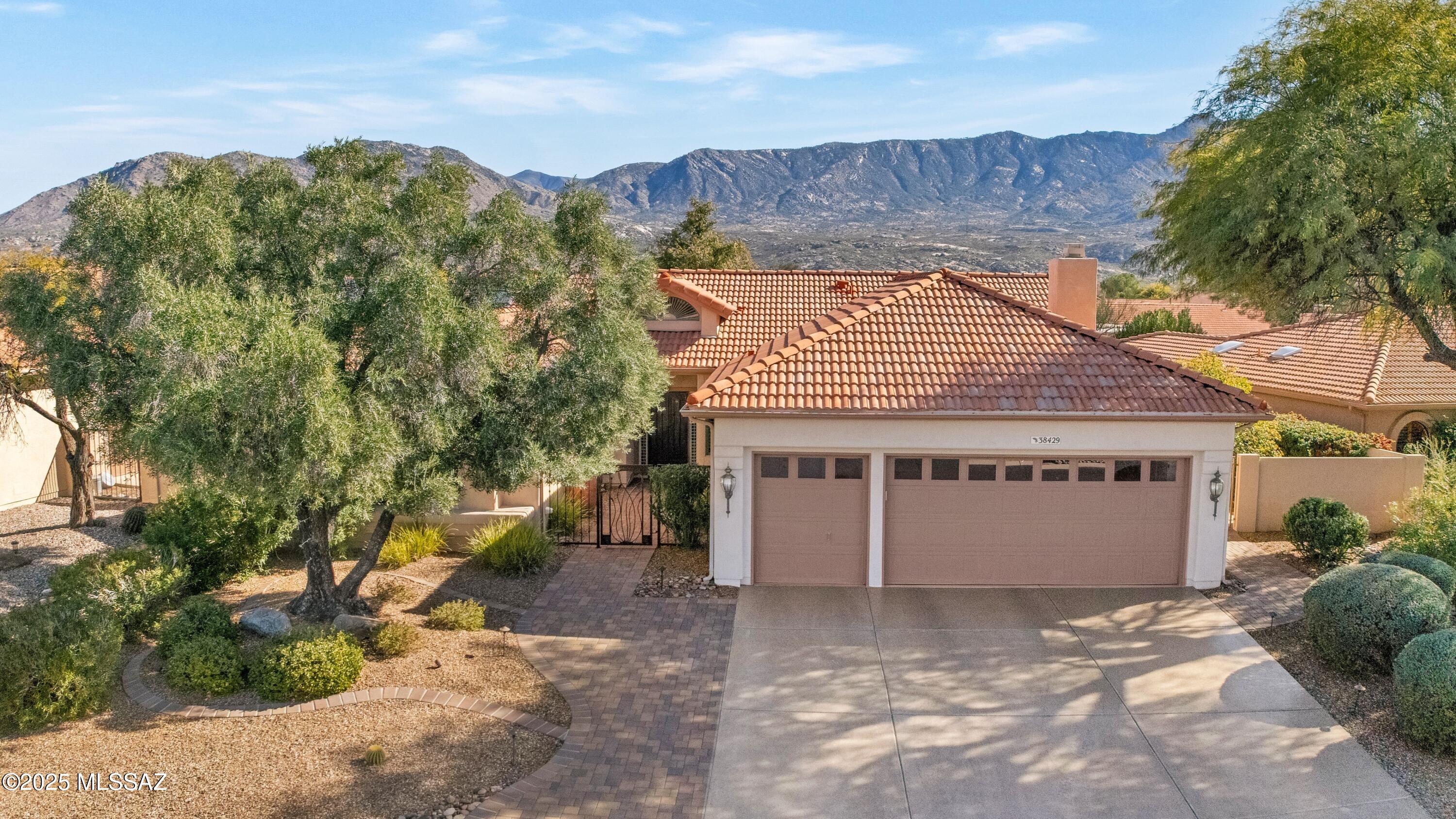 Beautifully Updated Coronado with Mountain Views! Epoxy Coated Driveway & Paver Walkway to Custom Entry Door. Living/Dining Room has Built-in Accent Wall with Electric Fireplace & Slider to Patio. Kitchen has Black Appliances, Gas Cooktop, Island with Prep Sink, Pantry & Desk. Family Room has Gas Fireplace & Slider to Patio. Owner's Suite has Slider to Patio & Electric Security Screen on Window. Owner's Bathroom with Quartz Counter, Walk-in Shower & Closet. Guest Bedroom with Closet. Guest Bathroom with Walk-in Shower. Laundry Room with W/D, Sink, & Cabinets. 2025 Roof Underlayment Replaced & 2019 Irrigation System. Extended 2.5 Car Garage with 2021 HVAC's, 2025 W/H, & Epoxy Coated Floor. Covered Patio has BBQ Station & 4 Electric Rolling Shades. Extended Patio, Fruit Trees & Gated Yard!