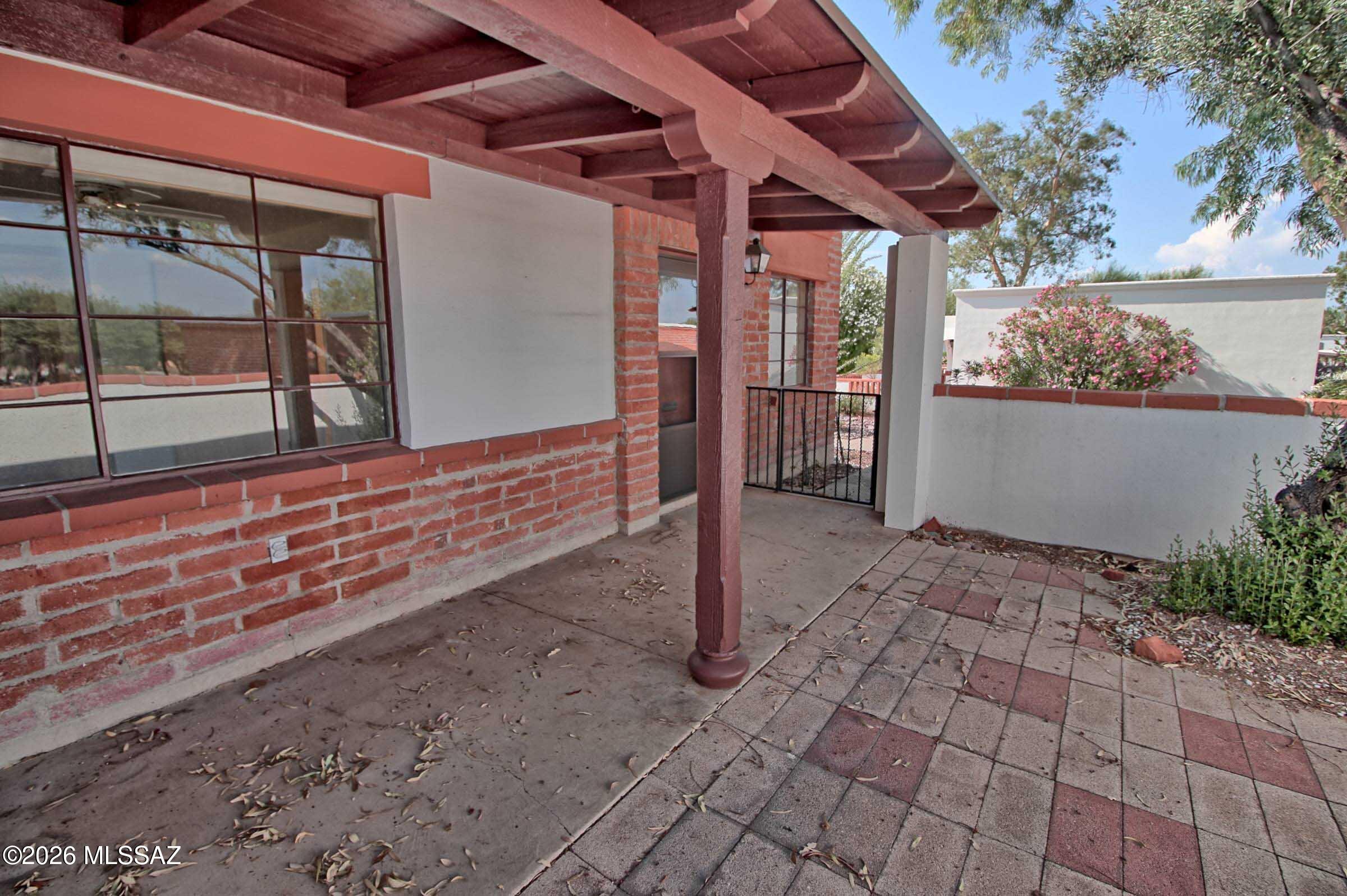 READY FOR YOU TO MAKE IT YOUR OWN! This clean and well-maintained corner-unit villa sits peacefully back from the street, offering beautiful Santa Rita Mountain views from the shady front porch. Enjoy your morning coffee or evening sunset from the charming patio, complete with a mature tree and pavers.

Inside, you'll find easy-care flooring throughout, a gas range, refrigerator and microwave. The home is priced with room for the new owner to add their own personal touches and upgrades, making this a wonderful opportunity to create a space that truly feels like home.

Enjoy an easy, low-maintenance lifestyle with mature community landscaping, a sparkling pool and spa, and convenient laundry facilities just a short distance away. And for those looking to enjoy even more of the active Arizona lifestyle, GVR access comes with this unit.

With its mountain views, private setting, outdoor living space, community amenities, and opportunity to personalize, this villa is ready for you to bring your vision and make it your own!