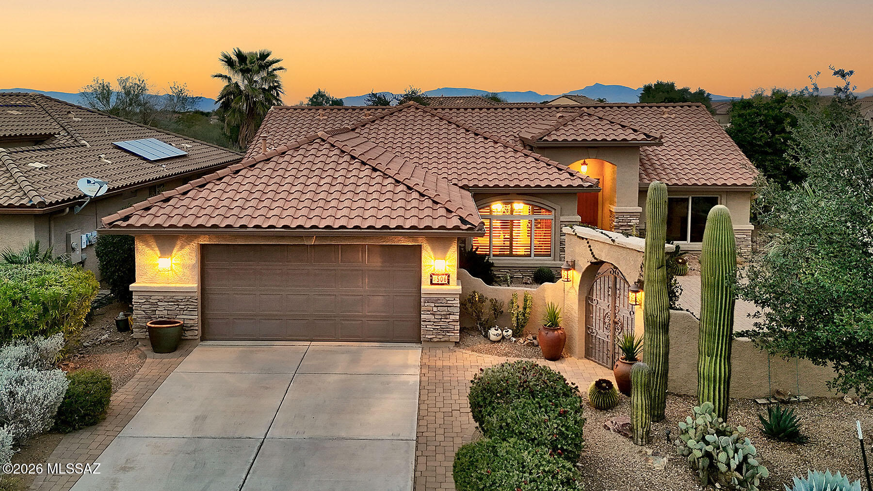 From the moment you arrive, this stunning residence makes an unforgettable first impression. A classic red-tiled roof, majestic Saguaro cacti, and graceful palm trees frame an arched entry that draws you into an expansive paved front courtyard -- a truly grand arrival experience. Whether you're sipping morning coffee in the sunshine or hosting cocktails under the stars, this remarkable outdoor space sets the tone for the elegance that awaits inside. Step through the front door and discover lush, luxurious finishes at every turn. Rich wood-look flooring flows throughout the home, anchored by a warm, glowing fireplace that invites you to linger. The elegant kitchen dazzles with high-end appointments and beautiful details that will delight even the most discerning buyer. Tucked just off the main living area, a lovely den overlooks the front courtyard and offers the perfect flex space -- open and airy when you want it, completely private when guests arrive.
The magic continues outdoors, where a sprawling back patio creates the ultimate desert entertaining oasis. Brick pavers, a built-in BBQ, and multiple gathering areas -- from intimate seating nooks to generous open spaces for large celebrations -- make every occasion feel special. A softly gurgling fountain serves as the peaceful focal point of it all, filling warm desert evenings with an irresistible ambiance. The thoughtfully split floor plan ensures privacy for everyone. Your primary suite enjoys tranquil views of the back patio and features a spacious walk-in shower, walk in closet and beautiful finishes.  
This home embodies the very best of desert luxury living -- and it's all set within the world-renowned Quail Creek community, where resort-style amenities and an active, vibrant lifestyle await you every single day.
Come and live your dream!