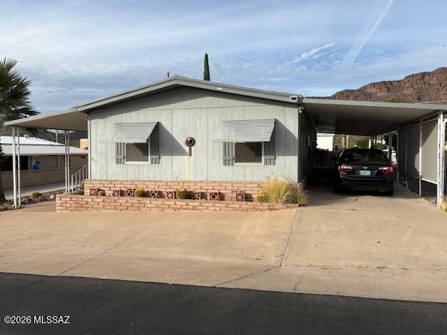 Nice 3 bedroom 2 bath home in desirable part of the community with a large covered porch on the east side of the house.  HVAC unit was replaced in 2019. One year old gas range. Two guest bedrooms in the front of the house and the primary bedroom is in the rear. The closets in the two guest bedrooms were removed and would need rebuilt if desired. The large kitchen is open to the dining area. Nice workshop/shed in the back. There is also a covered patio on the west side with pavers. Located in an active 55+ community, the HOA fee includes unlimited golf, tennis, pickleball, shuffleboard, pools, spa, fitness center, trash service, and much more. Best of all--you own the land. This is carefree living at its finest.