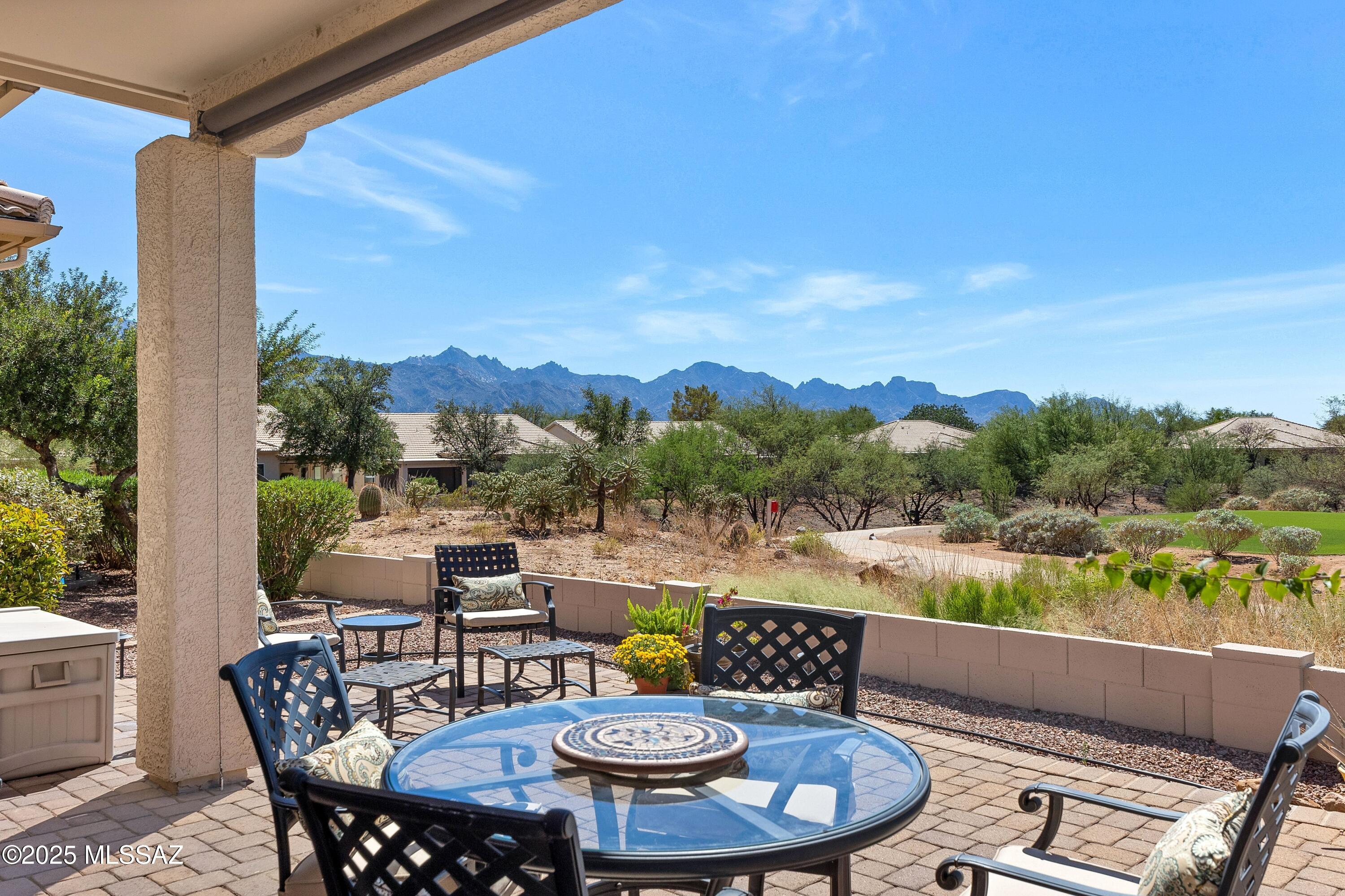 SOME FURNISHINGS AVAILABLE
Exquisitely updated Portofino Villa on premium lot w/golf course, lake & mountain views. Expanded paver patio offers privacy & resort-style outdoor living—ideal for coffee, sunsets & entertaining. Open great room plan with gas log fireplace, motorized light-filtering shades & luxury wood-look flooring. Remodeled kitchen with quartz counters, maple cabinets, hammered copper sink & LG stainless appliances incl. gas double oven. Primary suite features cedar accent wall, dual vanities & walk-in closet. Den/BR 2 with double French door entry. Major Updates: 2023 roof & HVAC w/air purifier; 2020 Milgard windows/doors; Navien tankless water heater; Pelican whole house water filtration system. Located in SaddleBrooke, an award-winning active adult community offering golf, pickleball, pools, dining, and vibrant social clubs. The Villas HOA covers landscaping, pest control, exterior paint, and roof maintenance and replacement, delivering true low-maintenance desert living.