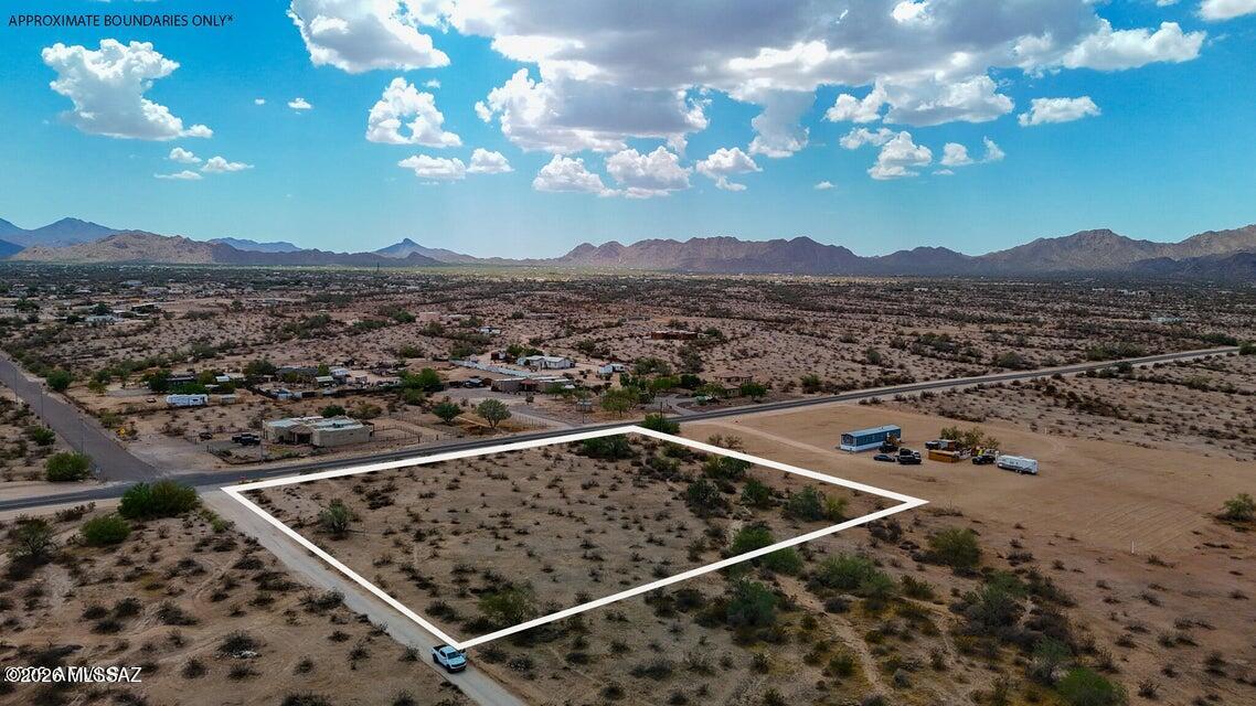 This 2.4 acre lot is located in the rural, but fast-growing town of Maricopa. Located on the Northwest corner of the paved Century and Ralston Roads, this level lot has power at the lot line and no HOA or CC&R's to restrict your freedom. This is the perfect property to build, install your manufactured, have horses, goats, chickens, and park all of your toys. SELLER FINANCING available with 50% down.