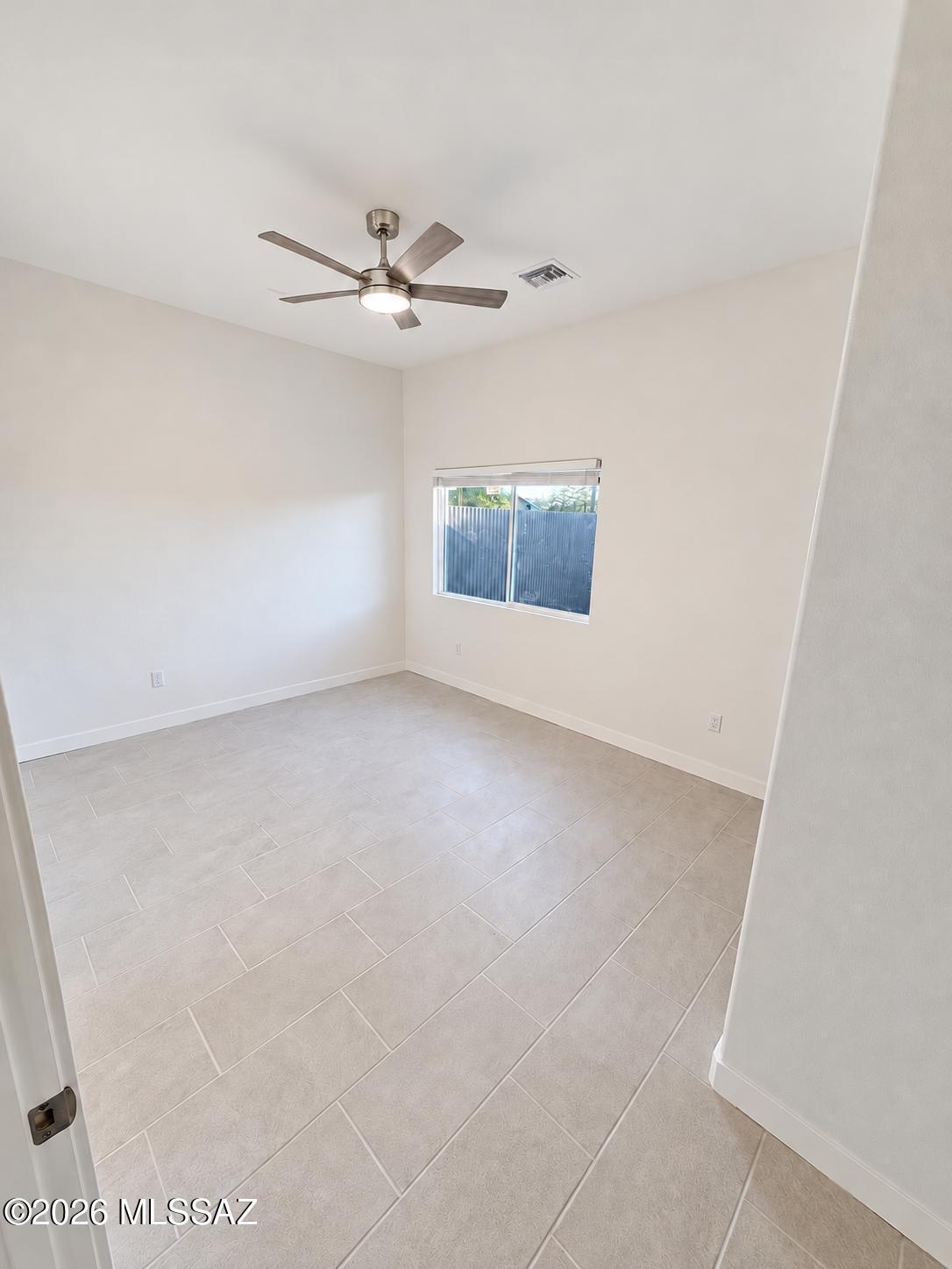 Rare new-build opportunity in Tucson's historic Jefferson Park neighborhood, less than five minutes from the University of Arizona. A brand-new, move-in-ready duplex with elevated finishes anchors this versatile three-residence property at 850 E. Seneca Street. Each 945-square-foot unit offers two bedrooms and two bathrooms, 10-foot ceilings, and a vaulted living room. The kitchens feature quartz slab countertops, custom cabinetry with 42-inch upper cabinets, and full-extension, soft-close drawers. Ivory Daltile ceramic tile extends to the shower ceilings, complemented by large-format Alpe Ivory floor tile. Each unit also includes LG appliances and an in-unit washer and dryer.
The property also includes a three-bedroom, two-bathroom single-family home with a carport, remodeled in 2026.