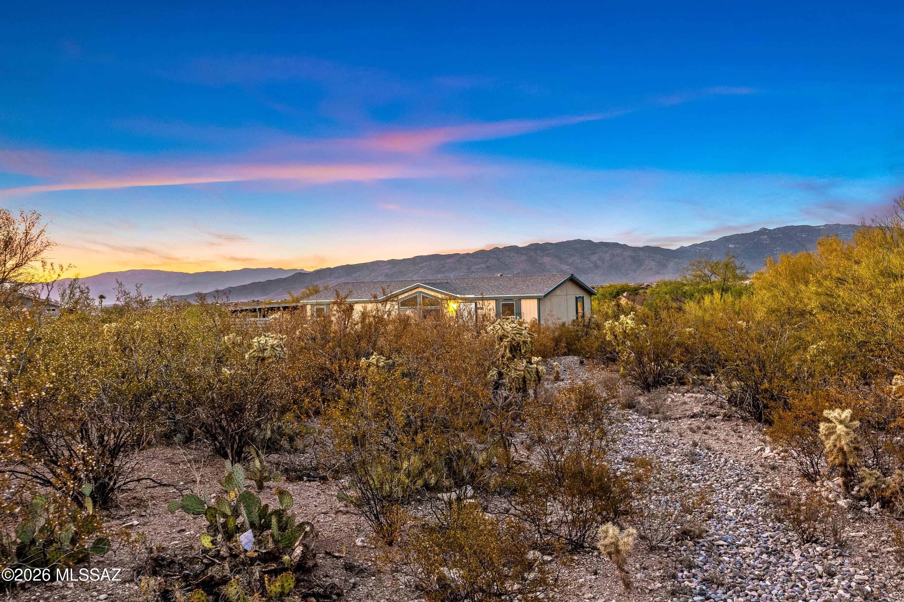 Enjoy serene desert living in this beautiful 3-bedroom, 2-bath home. Recent upgrades include fresh paint, a newer roof, a newer AC system, water heater, and a freshly pumped septic tank with capped risers. Inside, elegant wood shutters add timeless style, while large windows frame stunning mountain and desert views. Step outside to enjoy the built-in gas grill and outdoor living space, perfect for entertaining or relaxing amid the natural beauty of the surrounding landscape.