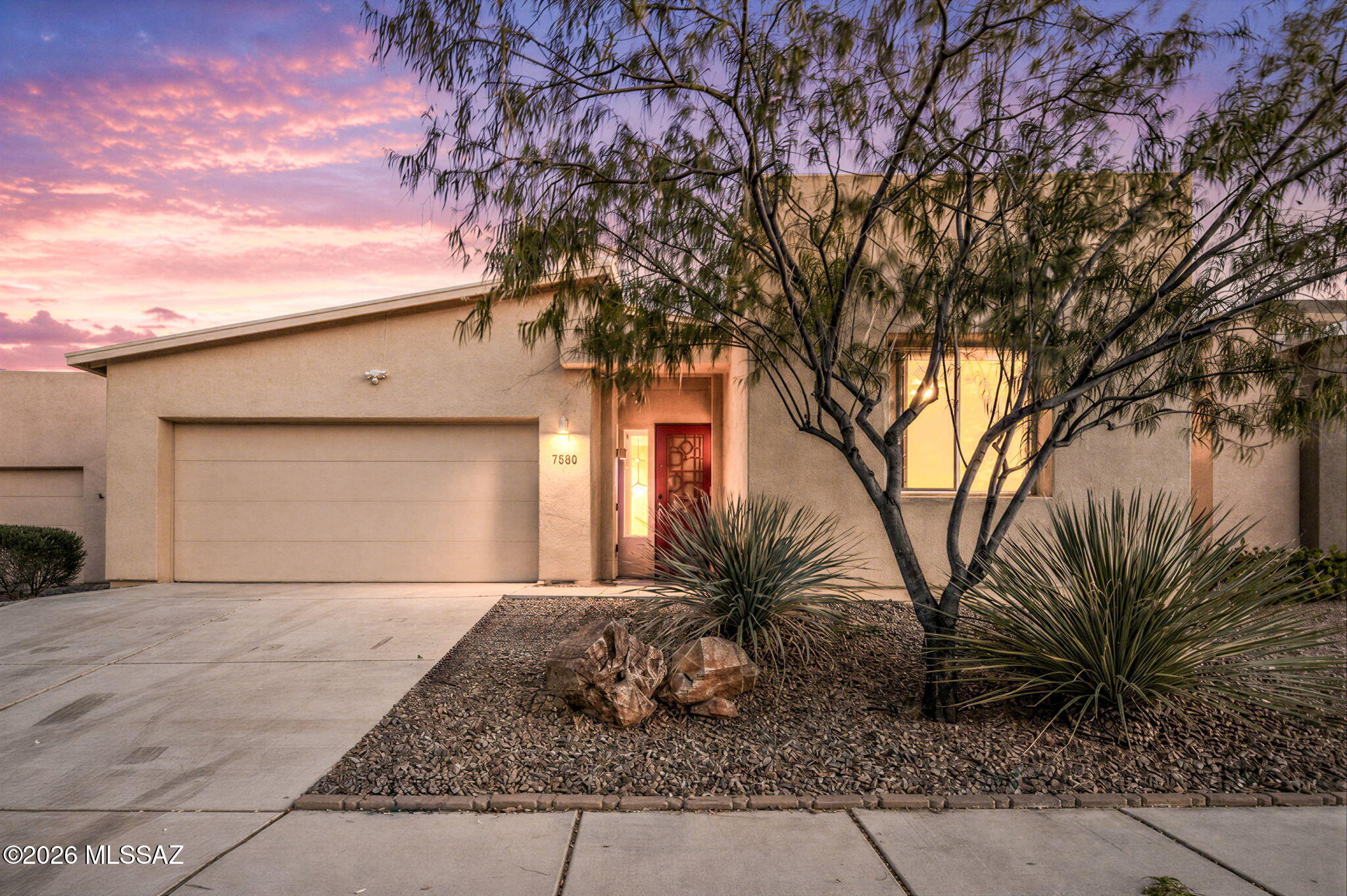 Located in the heart of Tucson's desirable east side, this like-new Pepper Viner built expanded Thoreau model offers the perfect blend of comfort, style, efficiency, and convenience. Thoughtfully designed with a spacious split-bedroom floor plan, this 3-bedroom, 2-bath residence delivers easy everyday living with a bright great room concept and an open kitchen ideal for entertaining or relaxing at home.

The expansive primary suite serves as a private retreat featuring a large walk-in shower, dual vanity sinks, and an oversized walk-in closet. Freshly painted interiors and brand-new carpet from Apollo Flooring give the home a crisp, move-in ready feel from the moment you step inside.