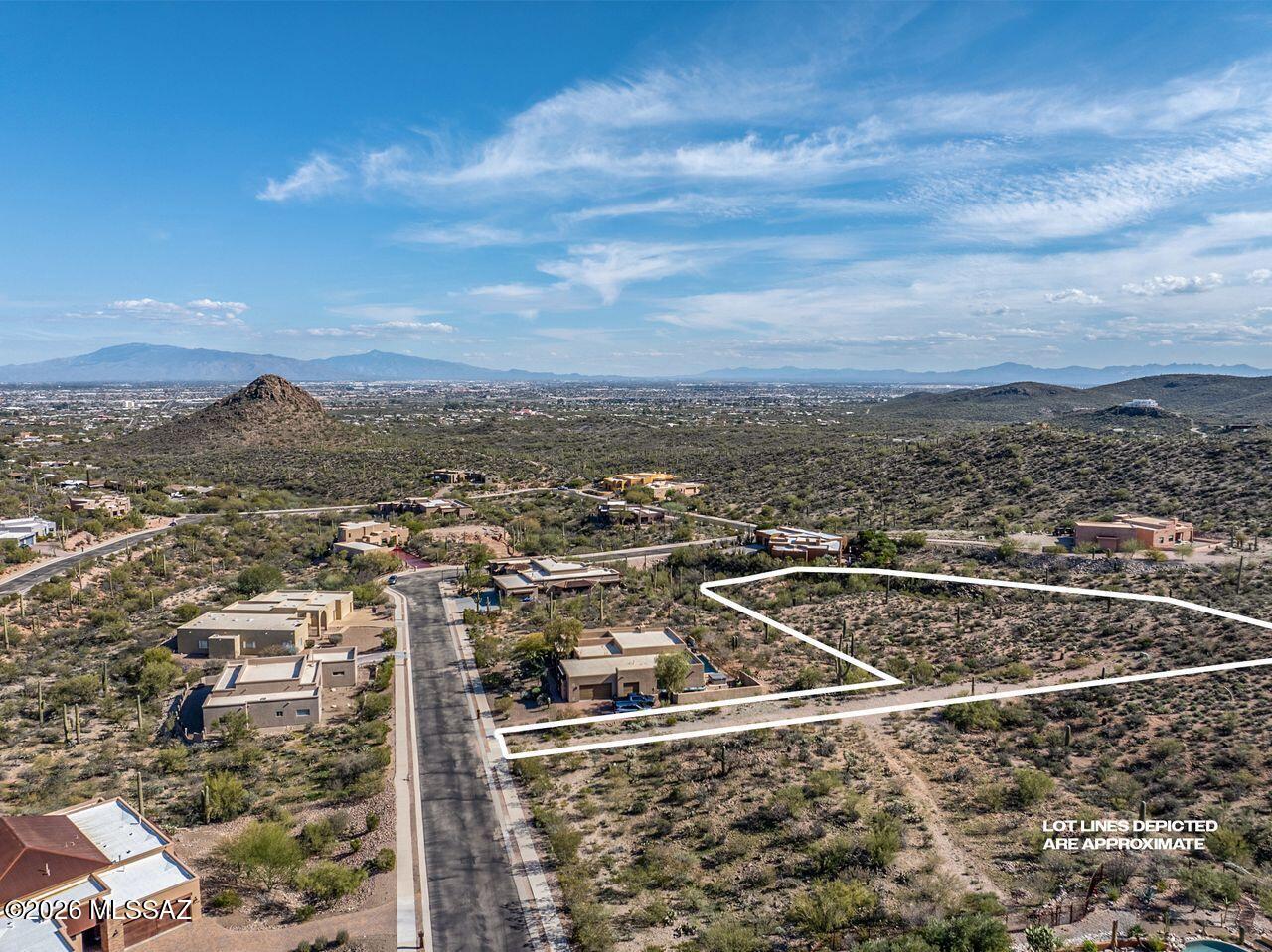 Beautiful Elevated View Lot in Prestigious Wildcat Pass. Over an acre of peaceful land to build your Custom Home. Gated community in Starr Pass near JW Marriott Resort,  Golf Courses, Restaurants, Pima College West Campus, U of A campus, Downtown Tucson, yet far enough from the hustle and bustle of a city to feel the exclusive privacy of a gated and beautiful place to call home.  Easy access to I-10.