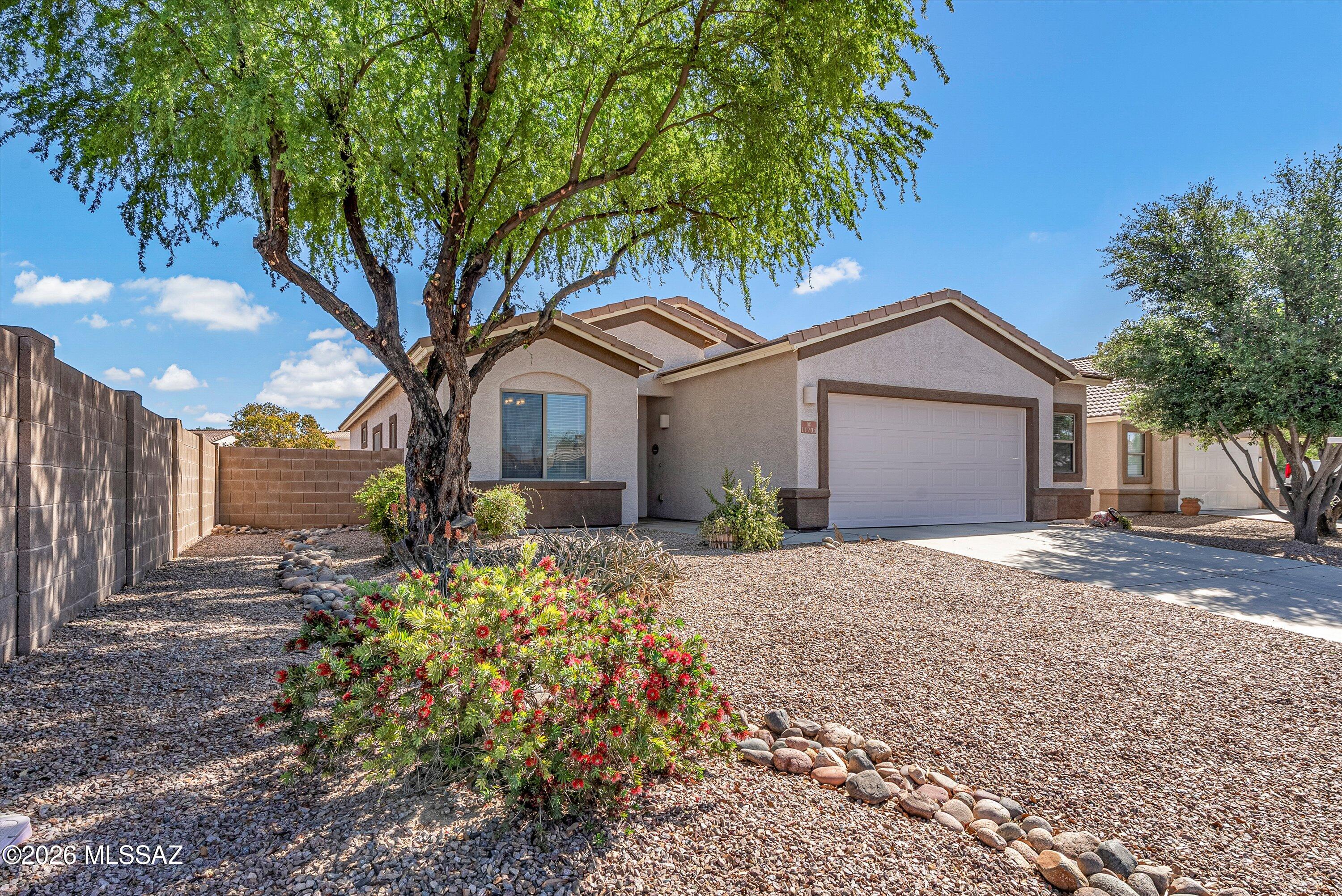 Welcome home to this beautifully refreshed single-story gem nestled in the sought-after Gladden Farms community of Marana! This Richmond American home has been lovingly maintained & recently updated - just unpack & start living! You'll love the impressive open great room floorplan - bright, spacious & ideal for entertaining or relaxing w/ family. Tile thru-out except the BRs! The huge kitchen is a true standout, featuring a generous breakfast bar & pantry, offering plenty of counter space & storage. The spacious primary suite offers a true retreat w/ a walk-in closet, dual sinks, a separate shower & a relaxing soaking tub. Fresh interior paint thru-out (03/26) fills every room with a light, airy feel, complemented by ceiling fans in all rooms for year-round comfort. The exterior was painted approximately 5 years ago & continues to show beautifully, while the landscaping & gravel have been freshly refreshed w/in the past year - adding great curb appeal from the moment you arrive. The HVAC system was replaced (2017), & a brand-new garage door was installed (02/26).

Step outside to enjoy your private, low-maintenance backyard from the comfort of a covered patio - perfect for unwinding on those beautiful Arizona evenings.
Living in Gladden Farms means more than just a home - it's a lifestyle. This vibrant master-planned community in Marana features parks, playgrounds & dedicated jogging & bike paths throughout. Gladden Farms Elem School is just steps away, & everyday conveniences are right around the corner - including Fry's grocery store, gas stations, McDonald's & more.
Don't miss this turnkey opportunity in 1 of Marana's most established & desirable communities.
