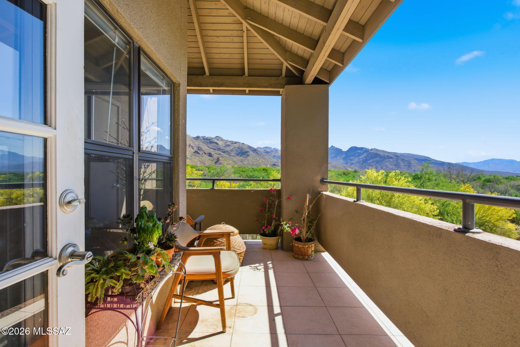 Come and live the Foothills resort lifestyle at an affordable price.  This low maintenance second story 3 bedroom/2 bathroom home features majestic mountain views from the interior rooms and from the outdoor balcony patio areas.   With porcelain tile throughout, granite countertops, and a split plan, this home is perfect for the working professional or a seasonal winter escape.  New HVAC in 2024 and windows in 2026, the roof and exterior is maintained by the HOA.   A stones throw away from one of three pools (2 heated), a fitness center and clubhouse.  Furnishings negotiable separately.  Why settle for a smaller unit with less space?  Come enjoy all of the Ventana Canyon amenities!