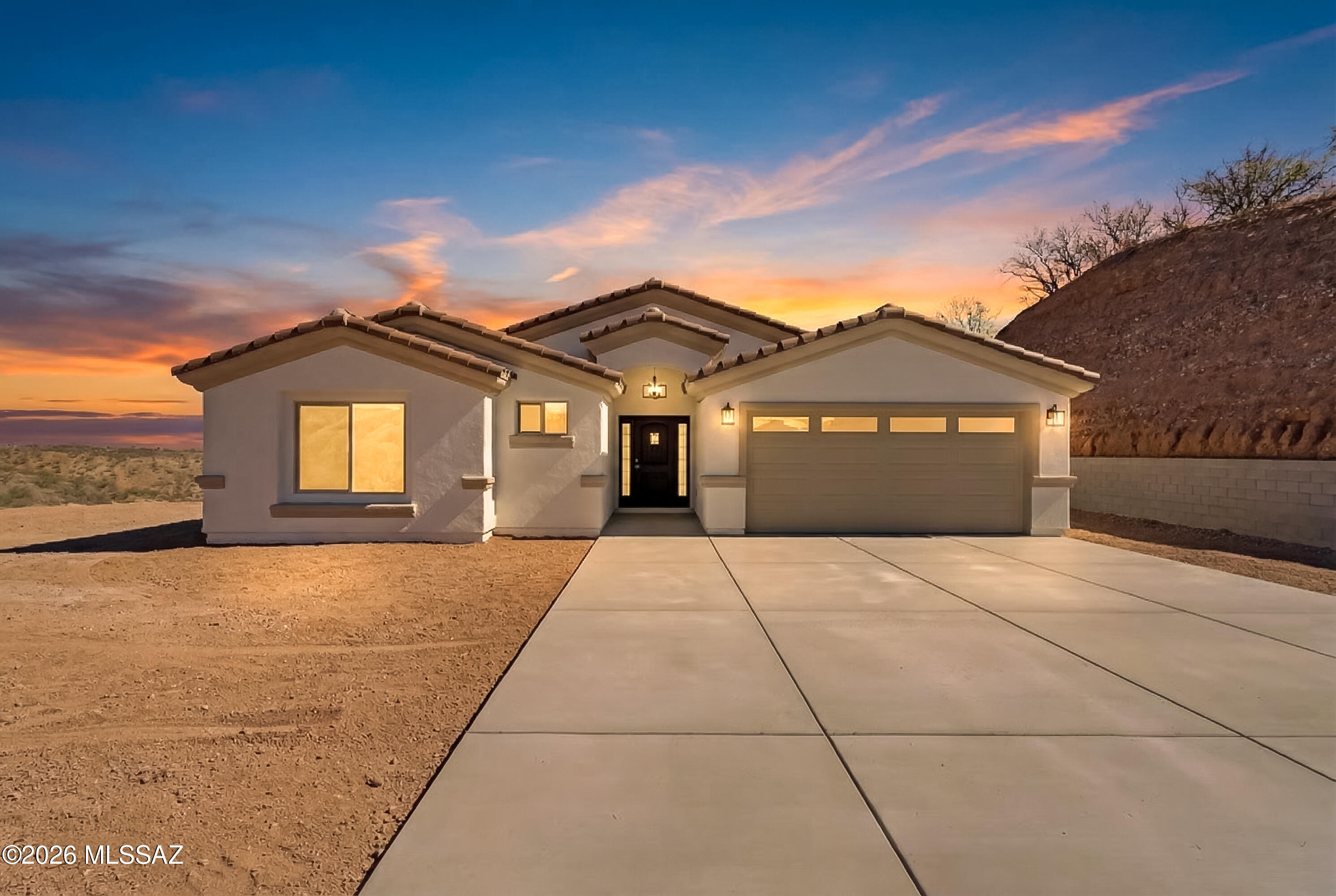 Set on an expansive 1.29-acre homesite, this new construction home delivers elevated design, durability and presence from the moment you arrive. 1,655 sqft of living space every detail was built with intention. A striking tile roof crowns the home, while a post-tension slab foundation ensures long-term structural integrity. The approach is unforgettable-featuring an impressive 4,076+ sqft of solid poured concrete driveway, a rare upgrade that speaks to both quality and functionality. Inside, the home centers around a handcrafted kitchen that blends custom craftmanship with modern style, creating a true focal point for everyday living. Positioned to capture spectacular, views, this property offers the perfect balance of privacy and elevated desert living.