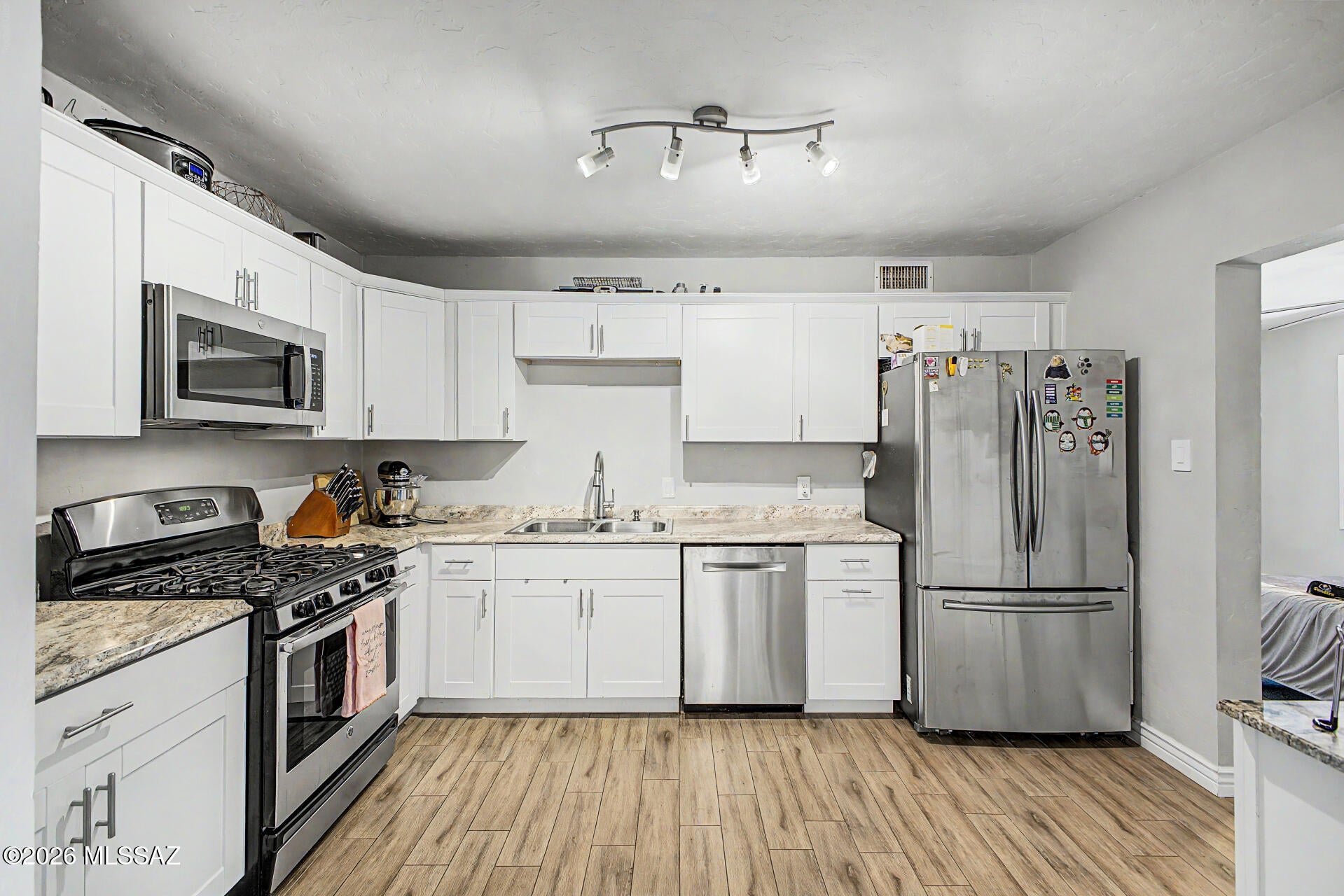 PAID SOLAR WITH MOTIVATED SELLERS!! Step into a piece of timeless charm with this beautifully updated 3-bedroom, 2-bathroom home that perfectly blends mid-century character with modern comfort. Built in 1950, this one-of-a-kind property showcases stunning interior rock work that adds warmth, texture, and a truly unique personality you won't find anywhere else. Inside, you'll find a newer HVAC system, brand-new carpet underfoot and a thoughtfully updated kitchen designed for both style and functionality, ideal for everyday living and entertaining alike. The home's classic bones have been lovingly preserved while modern upgrades ensure effortless comfort for today's lifestyle.