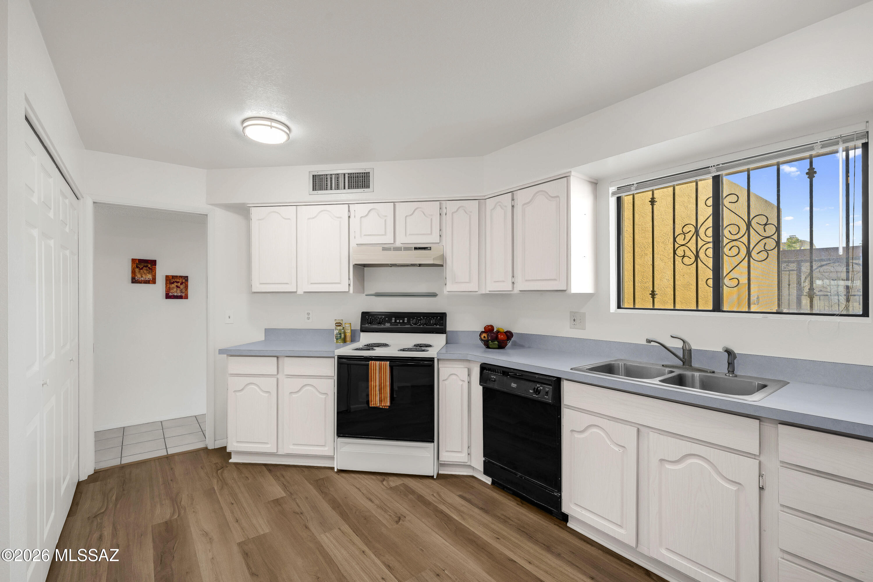 Nicely updated townhome has a large downstairs bedroom with on-suite bathroom, walk in closet & covered patio - ideal for enjoying the mountain view while drinking your morning coffee. Well thought out layout with welcoming entrance, kiva fireplace.  Generous kitchen with plenty of cabinets and counter space.  Separate guest powder room downstairs  Two large bedrooms and second full bathroom upstairs.  Two car garage with extra storage and car-length driveway.  HOA fees cover water, sewer, pool, spa and common area maintenance.
