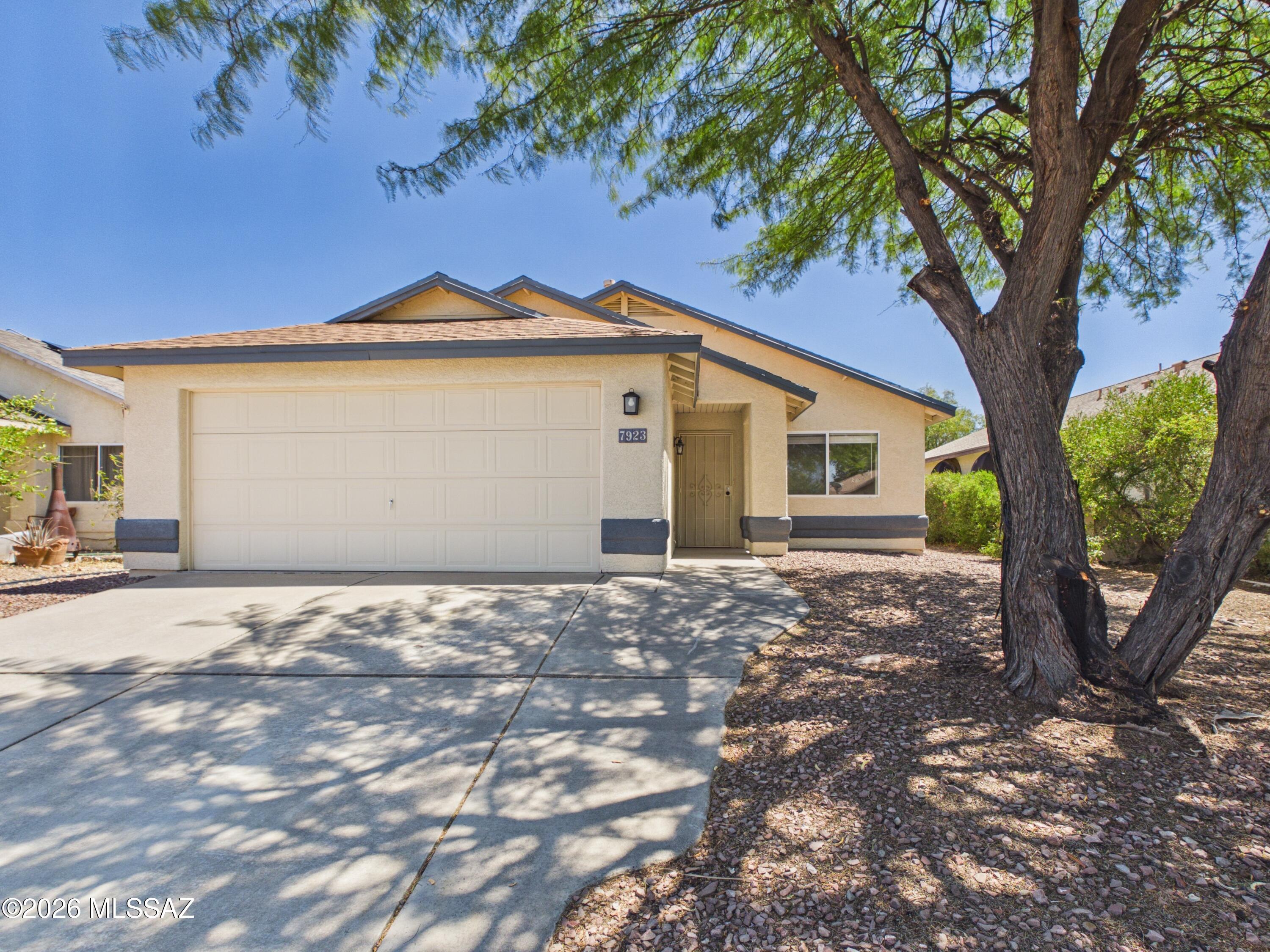 Move-in ready 3-bedroom, 2-bath home in the desirable Rita Ranch area! This single-story home features an open, light-filled floor plan with vaulted ceilings, updated flooring, and a spacious living area that's perfect for everyday living and entertaining. The kitchen offers granite countertops, stainless steel appliances, custom cabinetry with a built-in wine rack, and ample storage. The primary suite includes a private bath, while the backyard features a covered patio and block fencing for added privacy. Complete with a 2-car garage and conveniently located near parks, shopping, dining, and within the highly sought-after Vail School District.