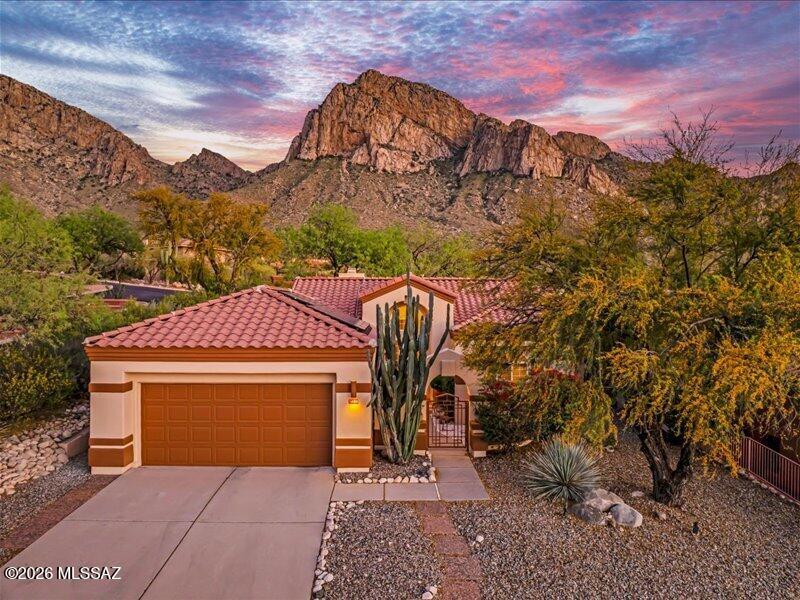 Beautifully renovated, perfectly-sized gem at The Ridge in guard-gated La Reserve. Filled with light and $100k+ in newly added upgrades:  completely new bathrooms, paid-off solar, closet built-ins, all new appliances (Wolfe range), new paint, new HVAC and new roof - ALL LESS THAN 3-4 YEARS OLD!  Private front courtyard, den area with built-in desk, a cozy fireplace and access to the shady patio from the primary suite. Complete privacy, dramatic elevation, silence and serenity, with a view of towering Pusch Ridge, standing sentinel in your back yard. If you've been waiting for the perfect La Reserve sensation, the wait is over.