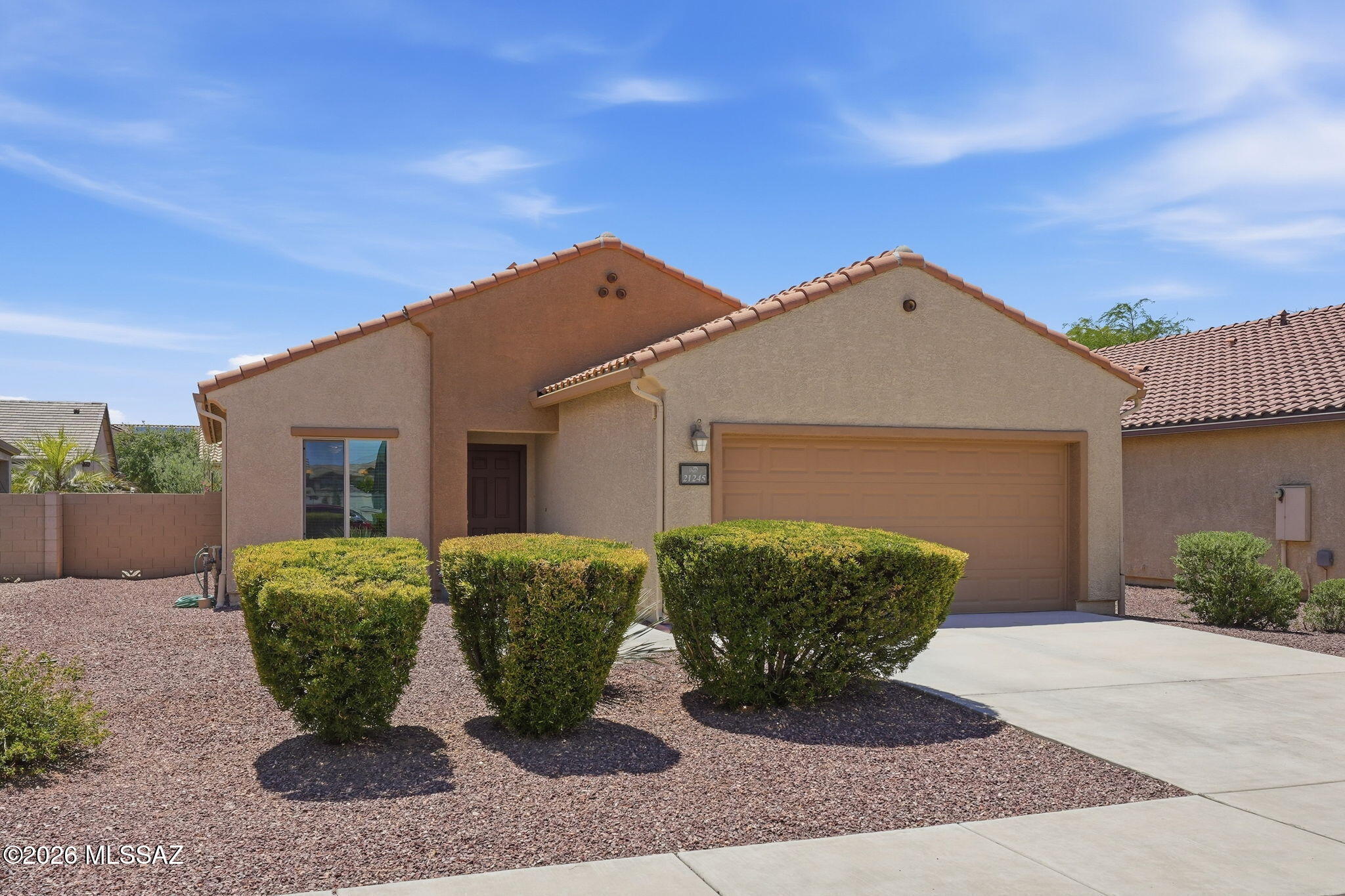 Come see this gorgeous, move-in ready and immaculately maintained home in Red Rock. This home has a spacious kitchen with delightful breakfast nook. The kitchen has upgraded granite countertops and black sleek appliances.  It opens on to a great room with built-in decorative shelves. The house is 3 bedroom and 2 full bathrooms with double vanities in each. The front and back yards are landscaped with low care trees and bushes.