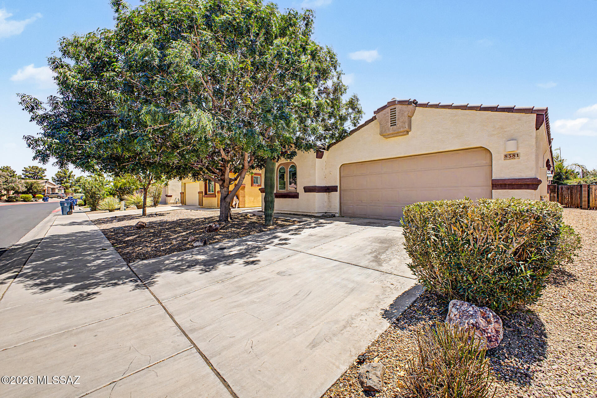 Welcome home! This charming single-story gem overlooks the golf course and offers beautiful mountain views. Enjoy open-concept living in the inviting great room filled with natural light, featuring tile flooring, vaulted ceilings, and a soothing palette that makes you want to stay. The kitchen displays oak cabinetry, ample counter space, built-in appliances & an island, perfect for midnight snacks. The owner's suite includes a practical walk-in closet for an easily organized wardrobe, an ensuite with dual sinks & sliding doors to the patio. Large den with easy outdoor access, perfect for a home office or hobby area. The backyard boasts a covered patio ideal for morning coffee, a grassy landscape, and offers fantastic views of both the golf course and mountains! You don't want to miss it!!!