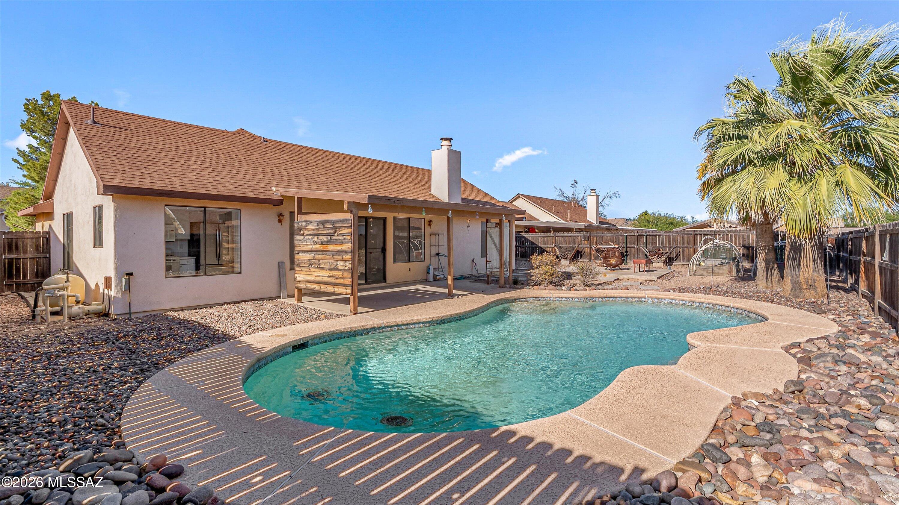 Freshly painted with new flooring throughout, this inviting home features a desirable great room floor plan and vaulted ceilings that create an open, airy feel throughout most of the living space. Step outside to enjoy the sparkling pool and spacious backyard, offering plenty of room for gardening, entertaining, or relaxing under the Arizona sky. The versatile den is perfect for a home office, hobby room, or potential additional bedroom. Whether you are a first time home buyer or simply looking for a place to stay cool and comfortable, this beautiful property is an opportunity you will not want to miss. Come take a look today!