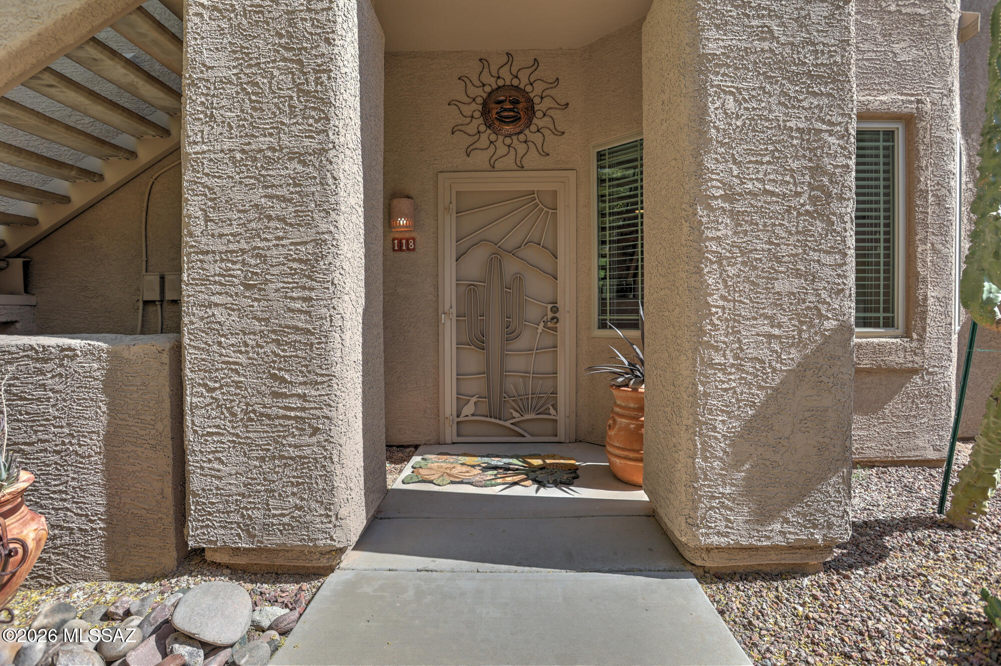 Buy your winter retreat and Airbnb when you're not using it. Located within the Vistoso Trail Nature Preserve, this fully upgraded ground-floor condo features high-end finishes including granite countertops, stainless steel appliances, hard-surface flooring, and beautifully remodeled bathrooms. The split-bedroom floor plan offers privacy, while the spacious primary suite offers a large walk-in closet. Both bathrooms include tiled walk-in showers with bench seats. Store your vehicles in the attached garage with additional storage space. Enjoy the upgraded flagstone patio overlooking the grassy common area. Located in the premier section of Vistoso Highlands with easy access to the heated pool, spa, recreation center, and private community amenities. Newer windows and Water heater.