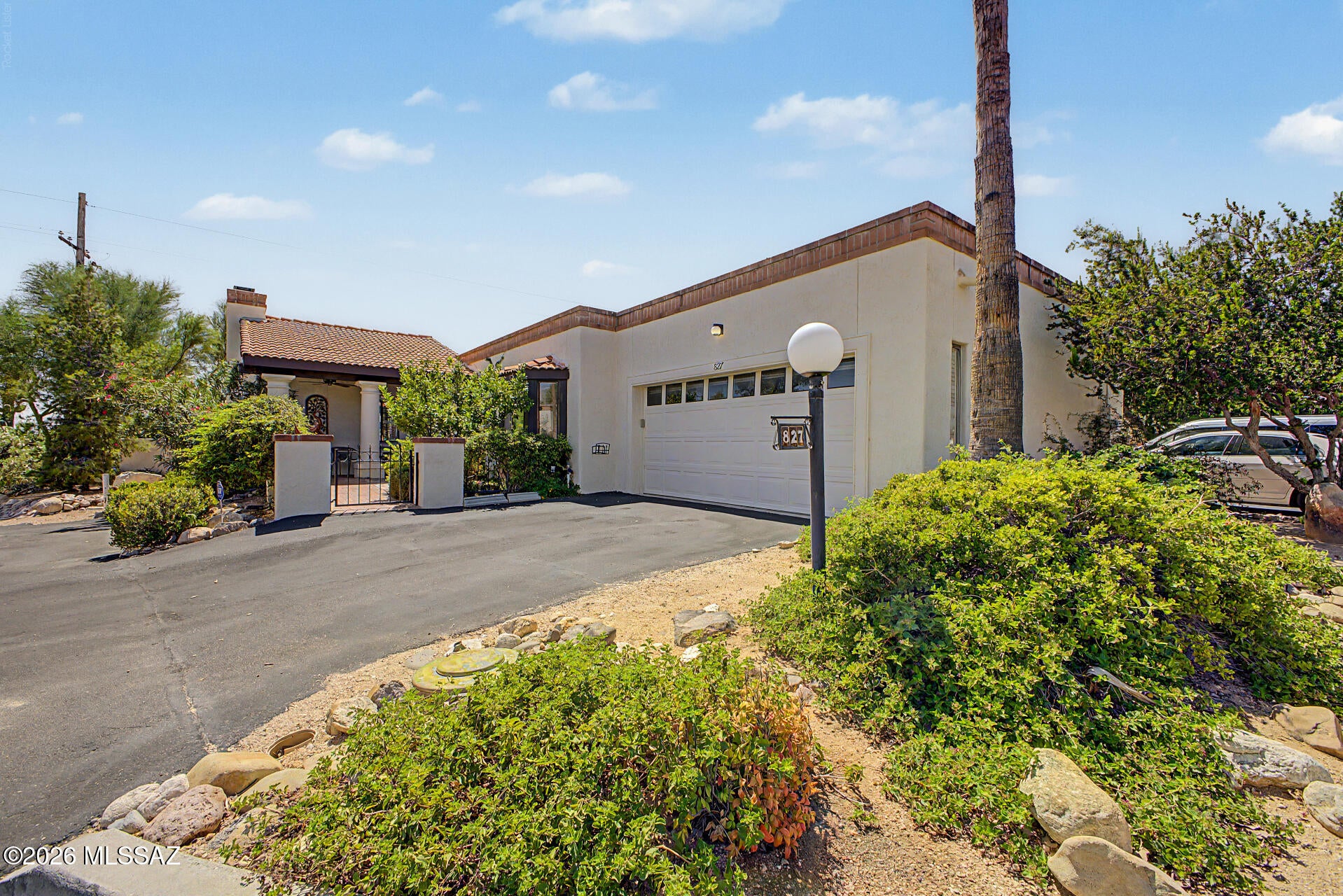 LOCATION, LOCATION, LOCATION! Enjoy inviting desert living in this charming 1,905 sq. ft. townhome featuring 3 bedrooms and 2 bathrooms, nestled within the desirable Sonoran Palms community.  Ideally situated in the heart of Tucson, this home offers exceptional convenience with shopping, grocery stores, restaurants, medical facilities, and everyday amenities just minutes away. Experience the perfect blend of comfort, convenience, and low-maintenance living in a sought-after location. Corner lot with lots of privacy. Great curb appeal with a front gated courtyard and a 2-car garage. 

Step inside to discover vaulted ceilings, Saltillo tile flooring, soft neutral tones, and plantation shutters that add warmth and character throughout. The spacious layout includes a formal dining room and a versatile den or third bedroom, ideal for a home office, reading room, or guest space. The bright and airy living room features a cozy woodburning fireplace and direct access to the outdoors, creating an inviting setting for both everyday living and entertaining.

The kitchen offers white cabinetry, granite countertops, a tile backsplash, stainless steel appliances, a breakfast bar, and a sunny breakfast nook with a bay window. The spacious primary suite provides private patio access and an ensuite bathroom featuring granite countertops, dual vanity,  and a large shower with sliding glass doors. The remaining bedroom and flex room are ample size and share the hallway bathroom. The laundry room is located off the garage.   

Step outside to enjoy peaceful outdoor spaces surrounded by picturesque desert scenery- perfect for relaxing or enjoying your morning coffee. Residents also have access to the community pool and spa, adding even more opportunities to unwind and enjoy the Arizona lifestyle.

Don't miss the chance to make this inviting Sonoran Palms townhouse your new home!