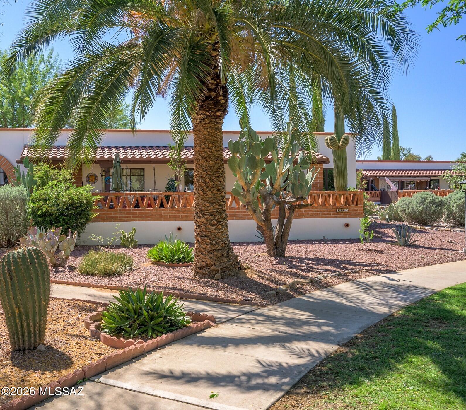 A statuesque saguaro is the first thing you'll notice as you approach this end unit Villa. The cozy patio overlooks the well-manicured green space directly in front of this unit, so you can enjoy views of the lush trees and grass without any of the maintenance. Use your imagination to update this Villa to be your perfect winter getaway.  Enjoy effortless living with a comprehensive monthly HOA that covers an impressive list of essentials, including access to the community pools, water, sewer, trash, and extensive major components--including roof, HVAC, exterior painting, landscaping, and even the water heater. It's the ultimate low-maintenance home designed for ease and peace of mind.  Located in a vibrant 55+ active adult community, you'll have more time to explore everything Green Valley Recreation has to offer, including fitness centers, swimming pools, and endless social activities.  Why rent when you can own your own desert escape? Secure your place in one of Southern Arizona's most popular retirement destinations today!