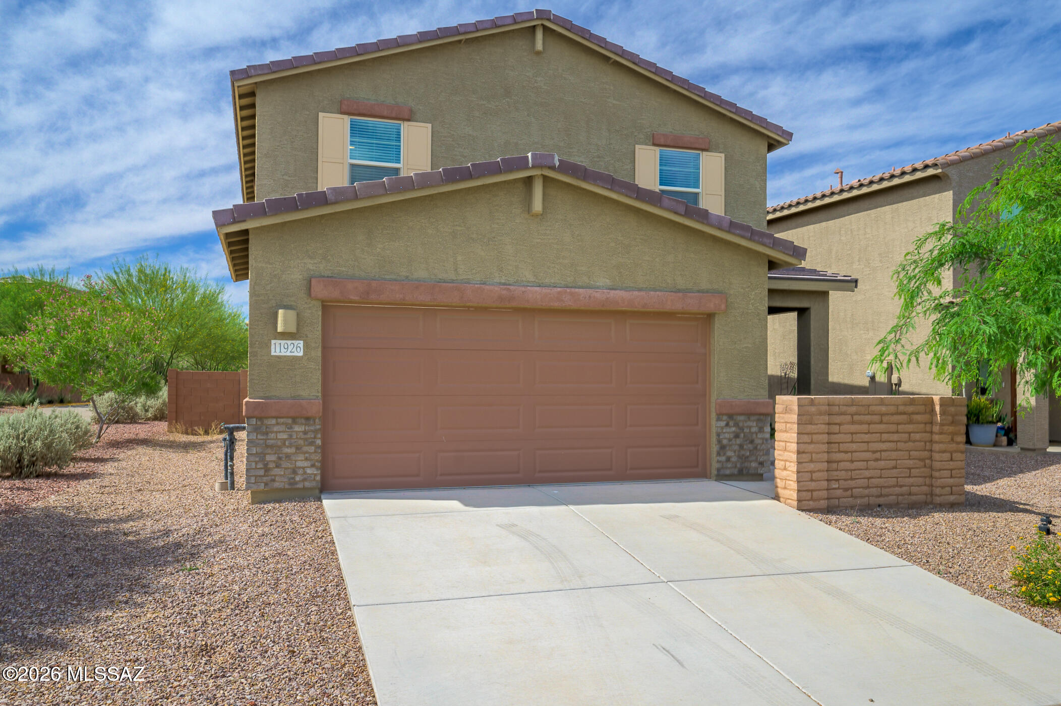 Welcome to this well-maintained 4-bedroom, 3-bathroom home offering 2,220 sq ft of living space in a growing Marana community. Built in 2023, this home features a functional floor plan with a convenient downstairs bedroom and full bathroom, ideal for guests, a home office, or multi-generational living. The spacious kitchen opens to the main living area, creating a comfortable space for everyday living and entertaining. Upstairs, you'll find additional bedrooms and flexible living space to fit your needs. Conveniently located near I-10, shopping, dining, parks, and Marana schools, this move-in ready home has been meticulously maintained and offers an excellent opportunity to own a newer home in a prime location.