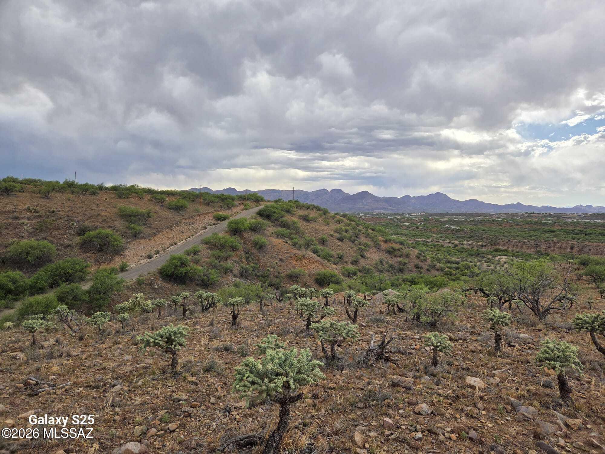 Double your opportunities with this 1.28-acre combined parcel on Higuera Court. Sold together, these adjacent lots offer maximum flexibility for a custom builder, developer, or homeowner looking for a spacious homesite. Located on a cul-de-sac, this property features breathtaking, unobstructed mountain vistas, making it the perfect setting for a high-end luxury residence. Secure your future in one of Rio Rico's most desirable areas.