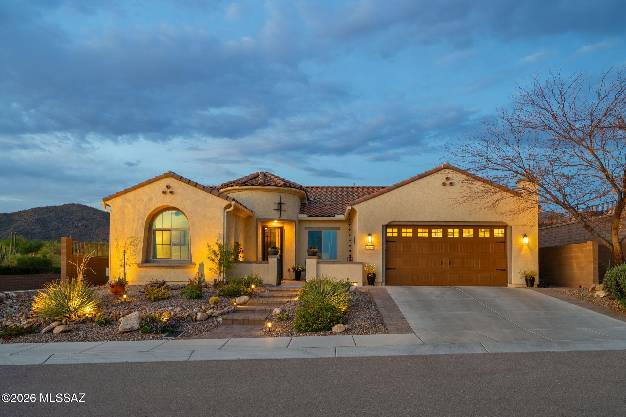 Welcome to resort-style living in the prestigious Del Webb at Dove Mountain! This stunning single-story home offers 2,337 sq ft in a vibrant 55+ community with breathtaking mountain views. Your private backyard oasis features a heated saltwater pool, spa, covered paver patio & low-maintenance artificial turf. The gourmet kitchen shines with granite countertops, gas cooktop & stainless appliances. Split bedroom plan w/ soaking tub, separate shower & double vanity in primary suite. 3-car tandem garage w/ EV charging, tankless water heater, smart thermostat, water softener & Quantum Fiber internet. Charming enclosed courtyard w/ pony wall adds curb appeal. HOA amenities include clubhouse, pool, spa, pickleball, tennis & rec center. A true gem -- come see it today!