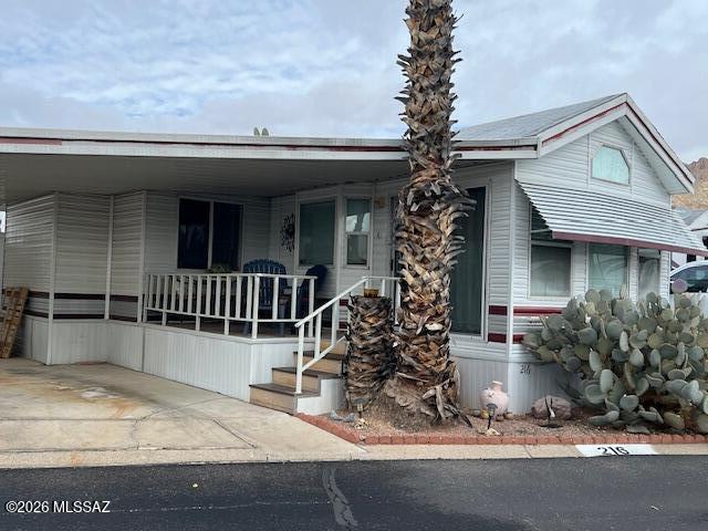 This 2 bed/1 bath home in Western Way RV Resort offers low-maintenance living in a vibrant active adult community. The 444 sq ft residence features handicap-accessible entry with modified stairs, a bright great room, and a kitchen with electric range, refrigerator, and ample cabinetry. One bedroom includes a large mirrored closet. Outside, enjoy low-care landscaping, a covered porch/deck, carport, and two storage sheds. Community amenities include pool, spa, library, rec center, pickleball, fitness room, billiards, and craft/puzzle areas.