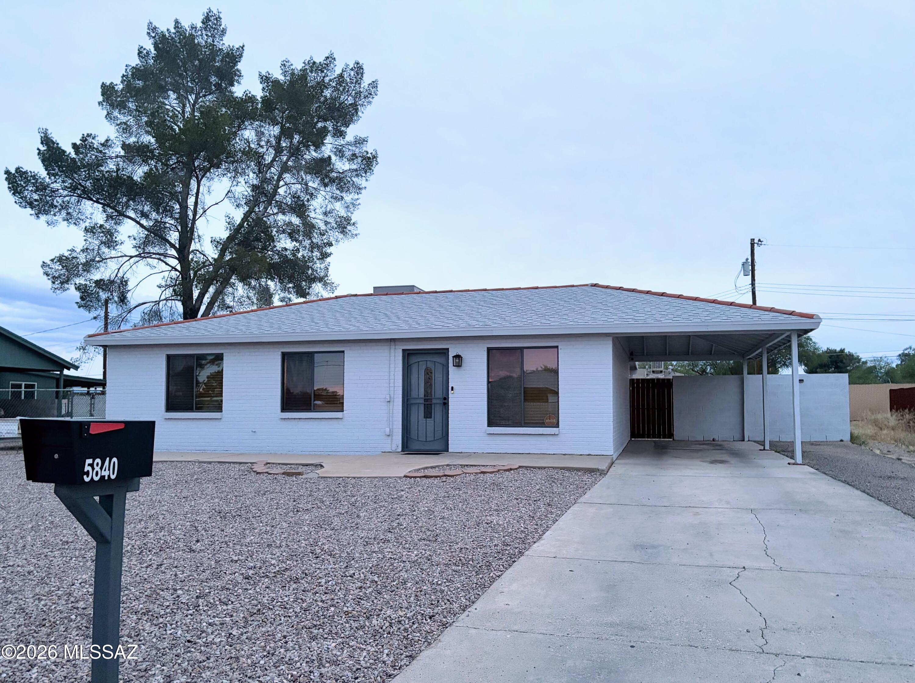 Located in the established Maryvale Manor neighborhood of Central Tucson, this beautifully refreshed Mid-Century 936-square-foot 3 Bed 1 Bath single-family home offers modern comfort and expansive outdoor space. The interior features a bright, open living area with recessed lighting and durable tile flooring throughout. The recently updated kitchen is a chef's highlight, boasting elegant granite countertops, hardwood cabinets, and a full suite of stainless steel appliances including a gas stove, dishwasher, and fridge. Both the interior and exterior have been treated to fresh paint, while the bathroom features a contemporary vanity and custom tile surround shower. For ultimate convenience, the home includes central air conditioning and heating, plus a high-end, full-size LG front-load washer and dryer set. The massive, fully fenced backyard is perfect for outdoor living, featuring a covered ramada for shade and a large 10x10 storage shed. Parking is easy with a dedicated carport space supplemented by additional off-street parking. This home considers dogs on a case-by-case basis but maintains a strict no-cat policy.
