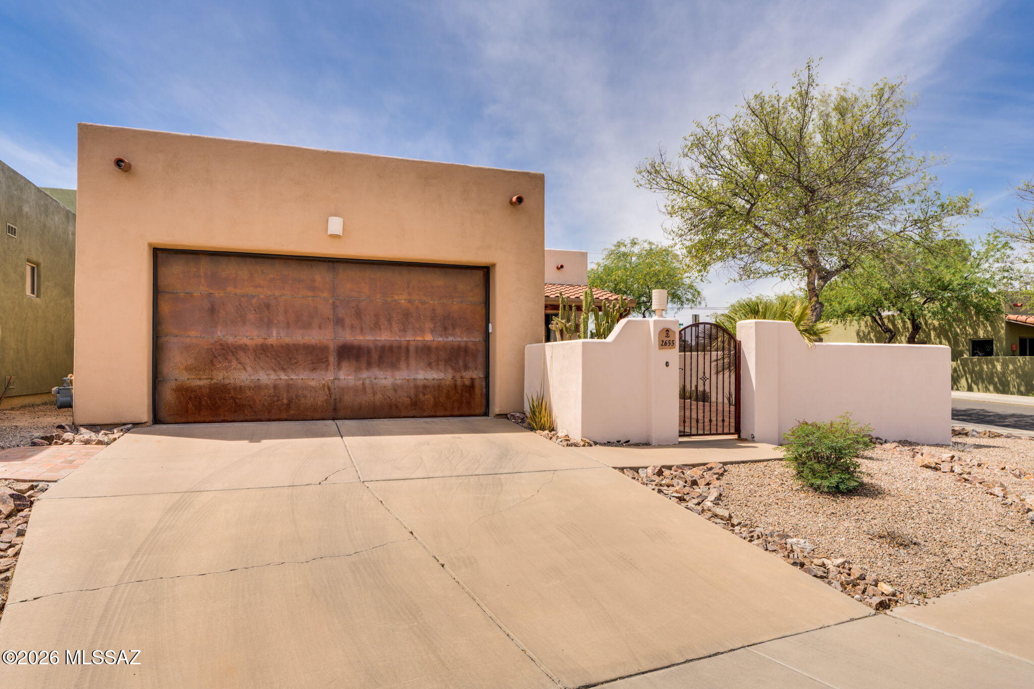 Built for comfort & efficiency, this thoughtfully upgraded home is just minutes from Ft. Lowell Park and the loop. Enjoy complete peace of mind with everything done on this one!  Newer (2024) 18 SEER HVAC system with UV filter, OWNED 12.15 kW SOLAR, and 28.6 kWh whole-house battery backup. Additional upgrades include a new electric water heater, hot water recirculator, whole-house filtration, softener, and reverse osmosis. Inside, you'll find luxury vinyl plank flooring throughout (NO CARPET!), fresh paint, and a spacious great room with beamed ceilings and a gas fireplace. The open kitchen is perfect for entertaining with new island and appliances.  Primary suite offers two walk-in closets, a soaking tub, walk-in shower, and dual vanities. Full list of upgrades in documents. PEACE OF MIND