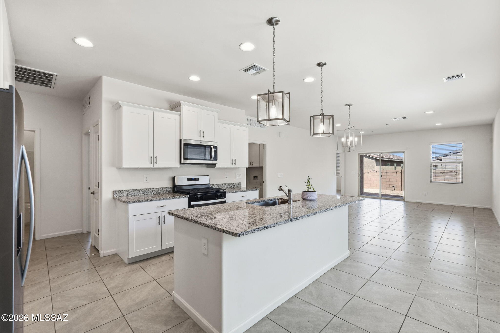 Basically new, for a REDUCED price! This single-story home has 3 bedrooms and 2 full bathrooms. Use the den as your work from home private space or play area.
The open concept floor plan allows you to entertain visitors in the living room. The kitchen has a large island, stainless steel appliances, granite countertops, and pantry! The primary suite has a walk-in closet, shower and dual sinks. Designed for comfort and efficiency, this home is move-in ready!
The backyard is a clean slate for you to make it your own!

Rancho Sahuarita offers extensive amenities including a splash pad, pools, walking and biking trails, fitness facility, amphitheater, lake and year round events with convenient access to I-19! This is a DEAL!