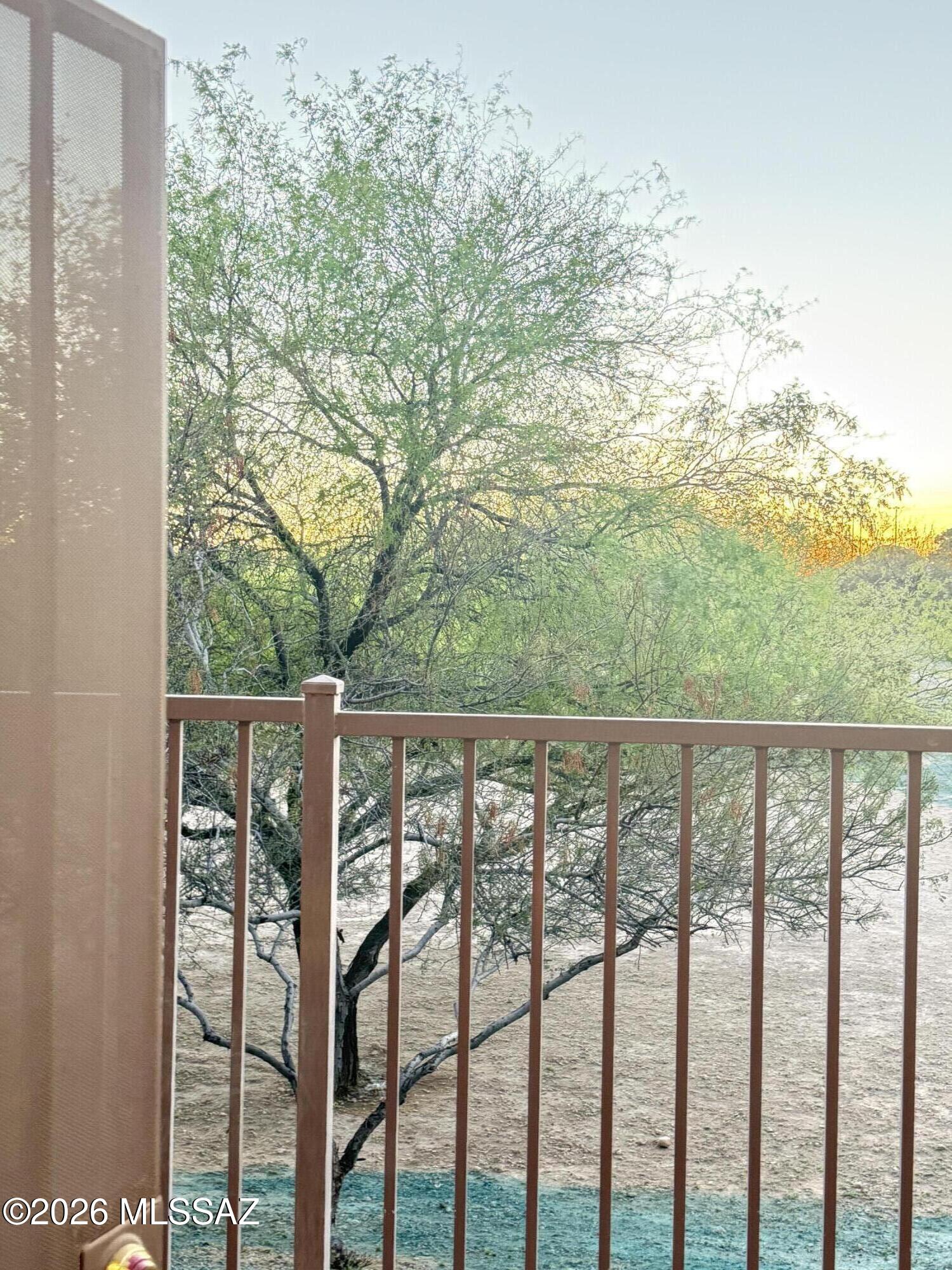 Beautiful 2bd 2ba townhome, 2 car garage, with no neighbors on one side or behind, beautiful views of the sunset.  High ceilings, wood laminate flooring, this townhome offers many amenities, including extra security fence and very clean back yard.  Close to shopping and schools.  Must see