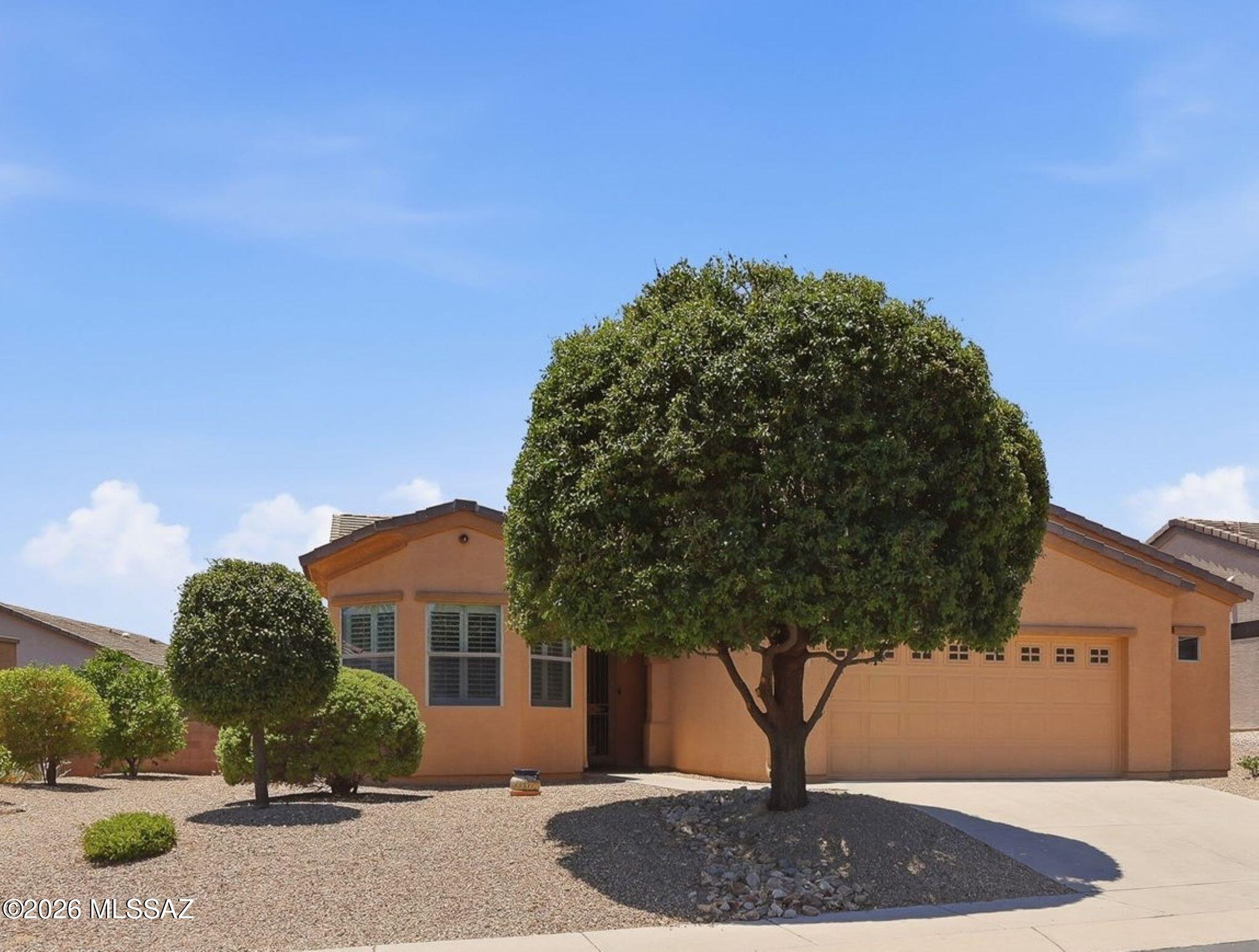 With a new roof & exterior paint in 2025 + owned solar for lower cost electric, this 2-bedroom, 2 bath + Den 1,584 sq ft home built in 2009 is well maintained so you can go out & enjoy all that Green Valley has to offer inc. golf, GVR facilities, Restaurants, Shopping & Farmers Markets! Return home to relax in a Screened Porch/AZ room or low care landscaped backyard. Security front & back doors allow air flow through the open concept living, dining & kitchen w/breakfast bar, pantry, ample quartz countertops & cabinets w/pull outs & gas range/oven. Split Bedroom Floor plan. Primary bedroom w/walk-in closet & en-suite bath w/walk-in shower. Diagonal tile flooring other than carpet in Bedrooms & Den. Water Softener. Lg. Laundry Rm. 2 ½-Car attached garage has storage & space for a golf cart!