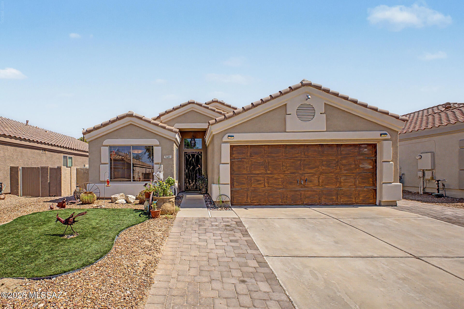 Welcome to this beautifully maintained and tastefully done 3-bedroom, 2-bathroom home nestled within the desirable gated community of Castle Rock. From the moment you arrive, you'll appreciate the care, comfort, and thoughtful updates that make this home truly move-in ready.

Inside, the inviting floor plan offers comfortable living spaces with modern laminate flooring in the kitchen and durable tile throughout the remainder of the home, with the exception of the dedicated home office. The well-appointed kitchen features stainless steel appliances and tile countertops, creating a functional space that is ready for everyday living and entertaining. Just beyond the kitchen, the family room welcomes you with a cozy gas fireplace--perfect for relaxing at the end of the day. The spacious primary suite offers a peaceful retreat with two closets one being a walk-in closet and a charming bay window overlooking the north-facing backyard. The primary bathroom is designed for comfort with dual vanities, a separate shower, and a relaxing soaking tub.

Step outside and discover one of the home's standout features: a private, north-facing backyard. The covered patio extends into a gazebo-covered outdoor living area, creating an ideal space for morning coffee, evening gatherings, or enjoying Arizona's spectacular skies. The custom-built-in BBQ area makes outdoor entertaining easy, while mature landscaping, decorative gravel, and artificial turf provide an attractive, low-maintenance setting you can enjoy without the constant upkeep.

Beyond your private backyard, Castle Rock offers an exceptional lifestyle with amenities designed for recreation and relaxation. Residents enjoy access to community lakes, a pool and spa, saunas, walking trails, sidewalks, basketball courts, an exercise facility, pickleball, and a playground.

Whether you're looking for a peaceful retreat, a low-maintenance Arizona lifestyle, or a welcoming gated community with amenities close to home, this Castle Rock property offers an opportunity worth seeing in person. Come experience the views, explore the backyard, and discover why this home deserves a place at the top of your list.